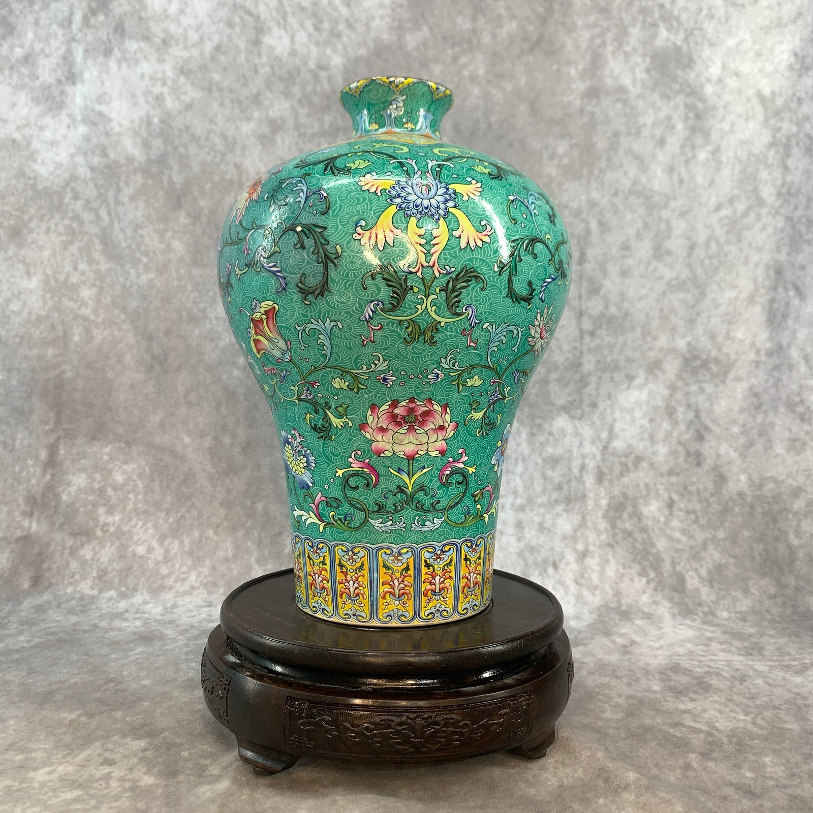 TURQUOISE GREEN GROUND "LOTUS SCROLL" PATTERN PORCELAIN MEIPING VASE: Qing Dynasty; High: 9 inch; Diameter: 6.2 inch; Woodbase for picture and display only