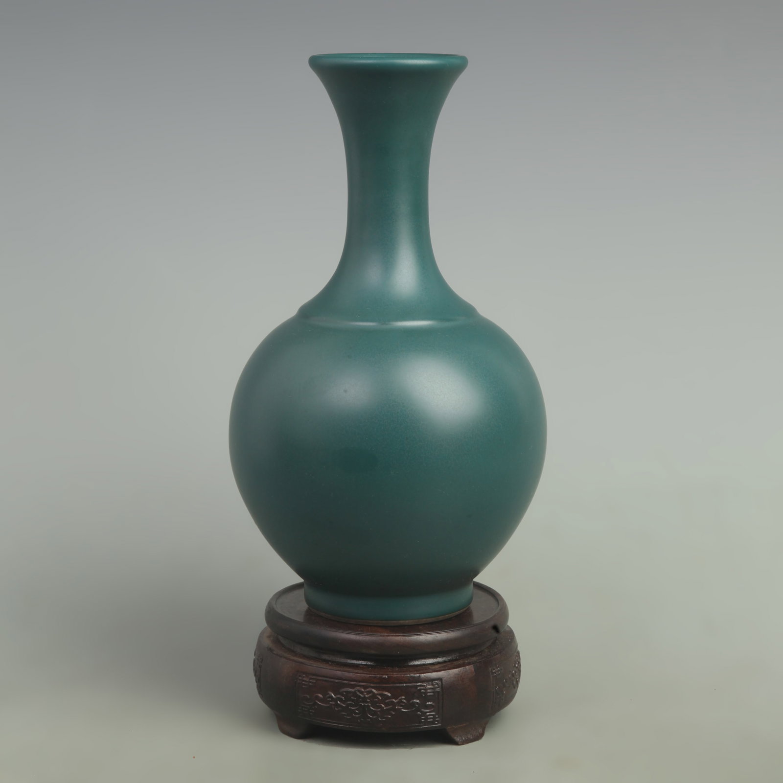 A FINE GREEN-GLAZED PORCELAIN BOTTLE VASE: Qing Dynasty Yong Zheng Period; High: 9.5 inch; Width: 5.5 inch; Woodbase for picture and display only