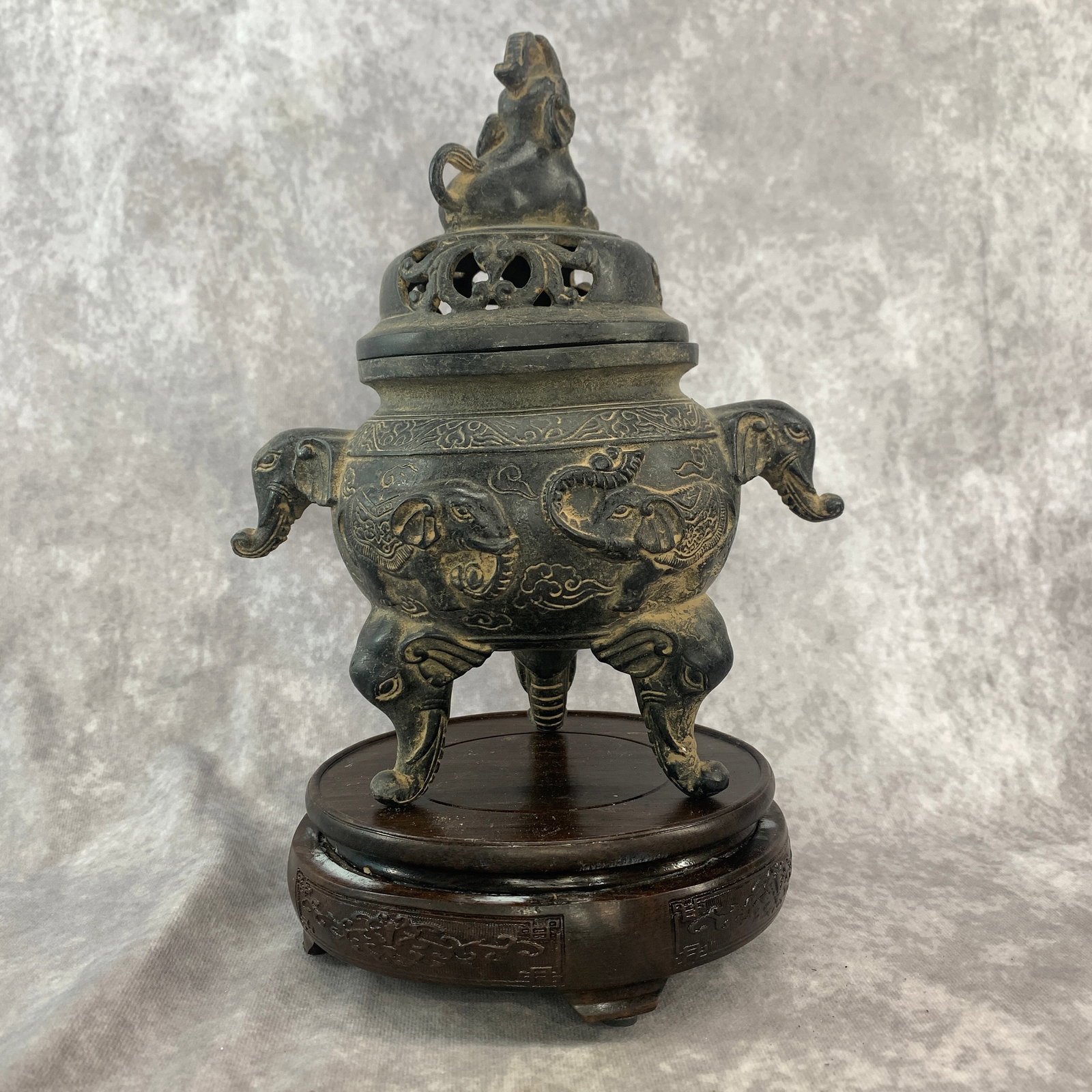 CHINESE BRONZE OR CAST IRON ELEPHANT-THEMED CENSER: 19th Century; Long: 8 inch; Width: 5.5 inch; High: 9.6 inch; Woodbase for picture and display only