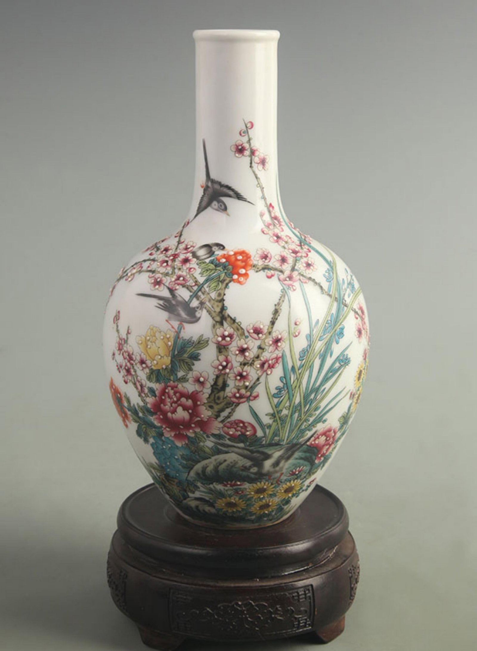 FAMILLE ROSE GLOBULAR VASE WITH MAGPIES AND PLUM BLOSSOMS: Qing Dynasty Qian Long Period; High: 9.00 inch; Width: 4.50 inch; Woodbase for picture and display only