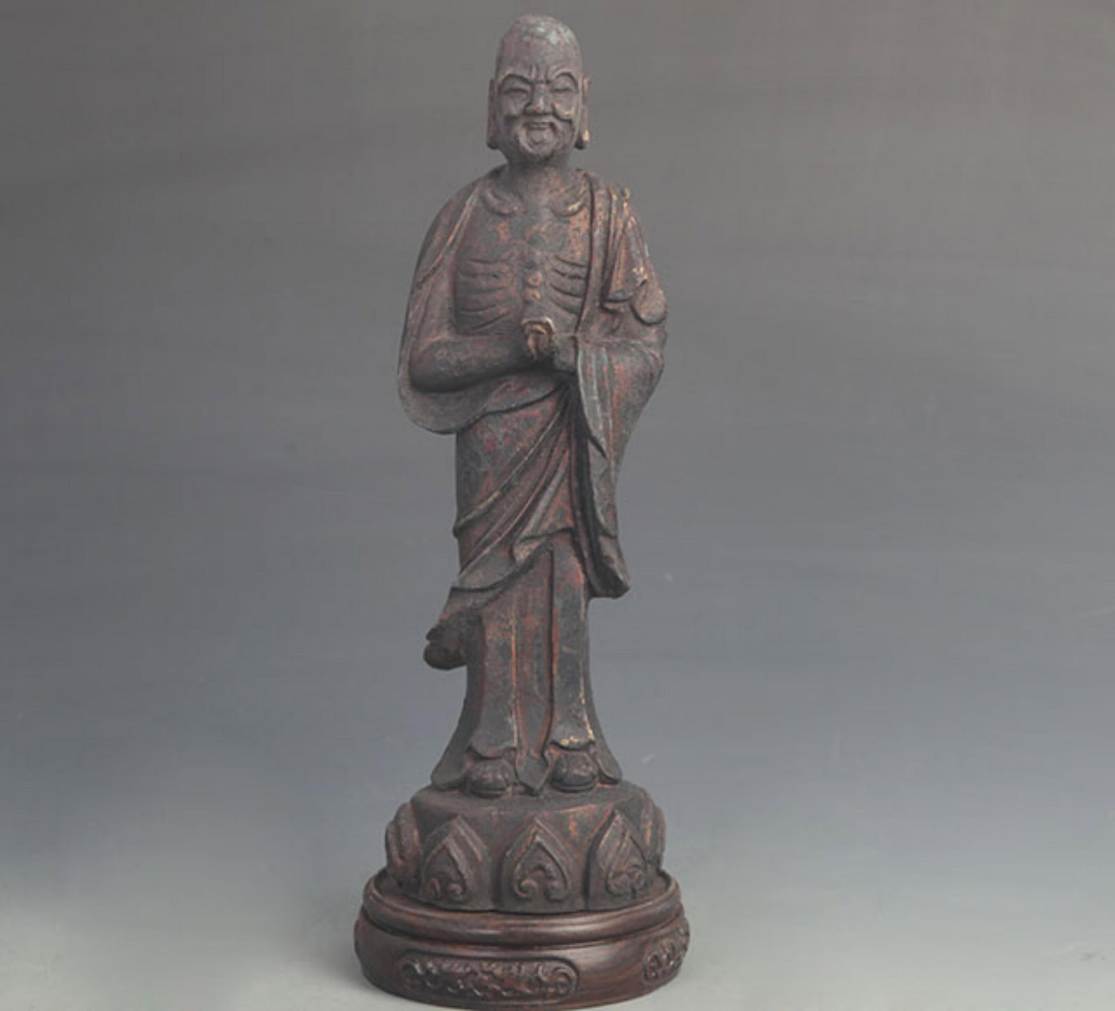 A FINE BRONZE ARHAT STATUE: 19th Century; High: 11.25 inch; Width: 3.25 inch; Woodbase for picture and display only