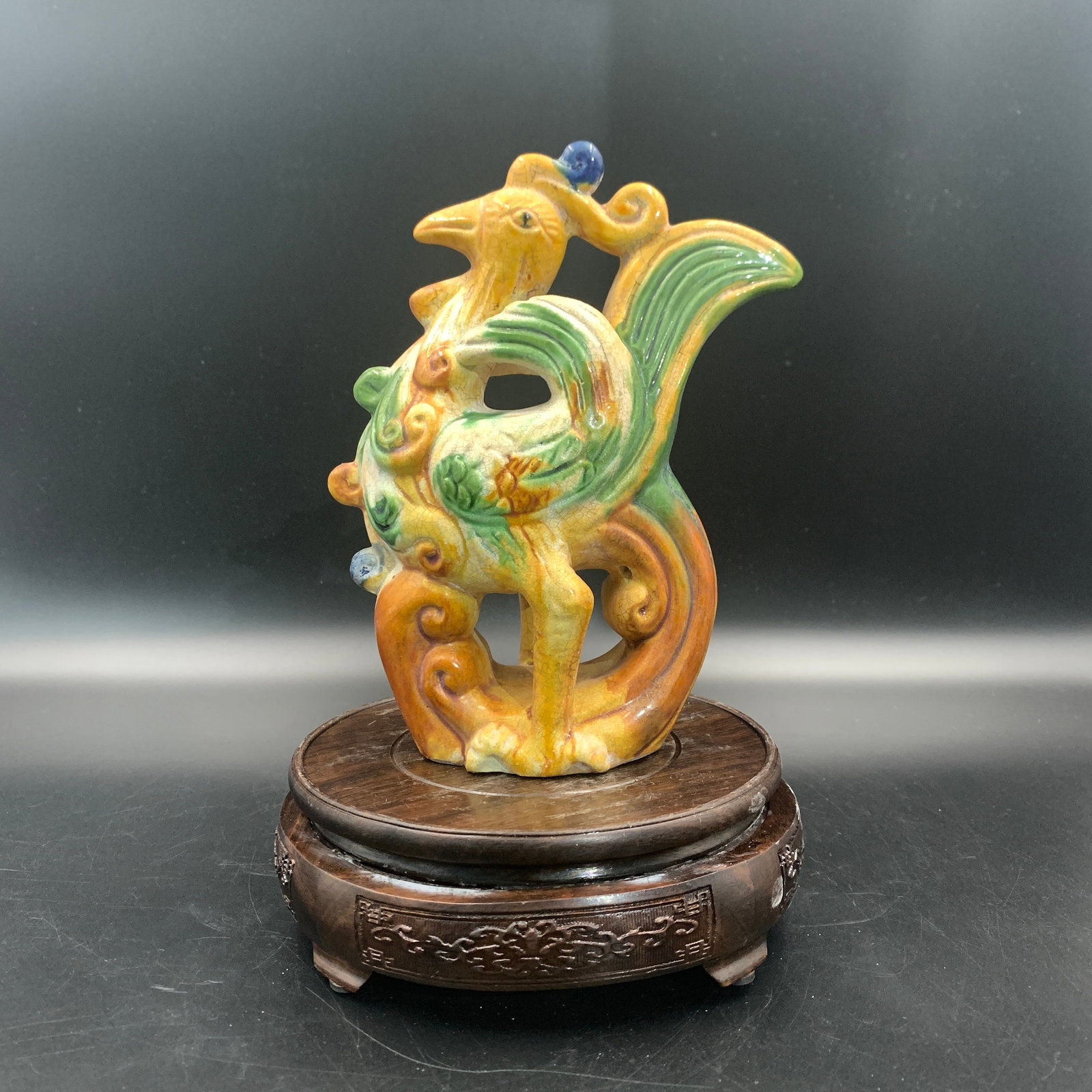 SANCAI (TRI-COLOR) GLAZED POTTERY PHOENIX STATUE: Tang Dynasty Style; Long: 5.8 inch; Width: 2.8 inch; High: 7.4 inch; Woodbase for picture and display only