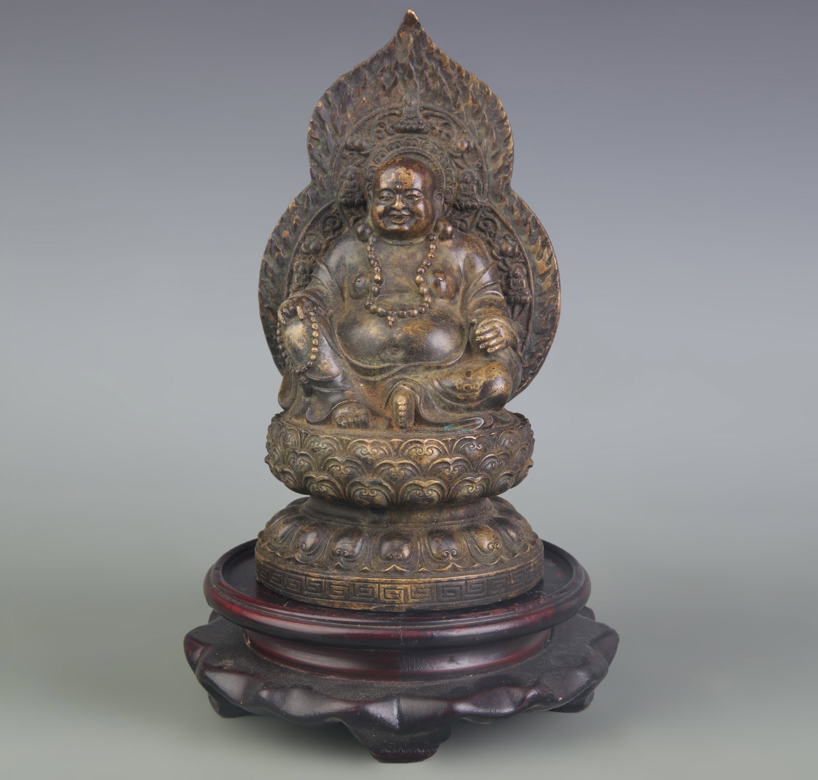 LACQUER-GILT BRONZE FIGURE OF BUDAI (THE LAUGHING BUDDHA): Qing Dynasty; High: 6.9inch; Woodbase for picture and display only