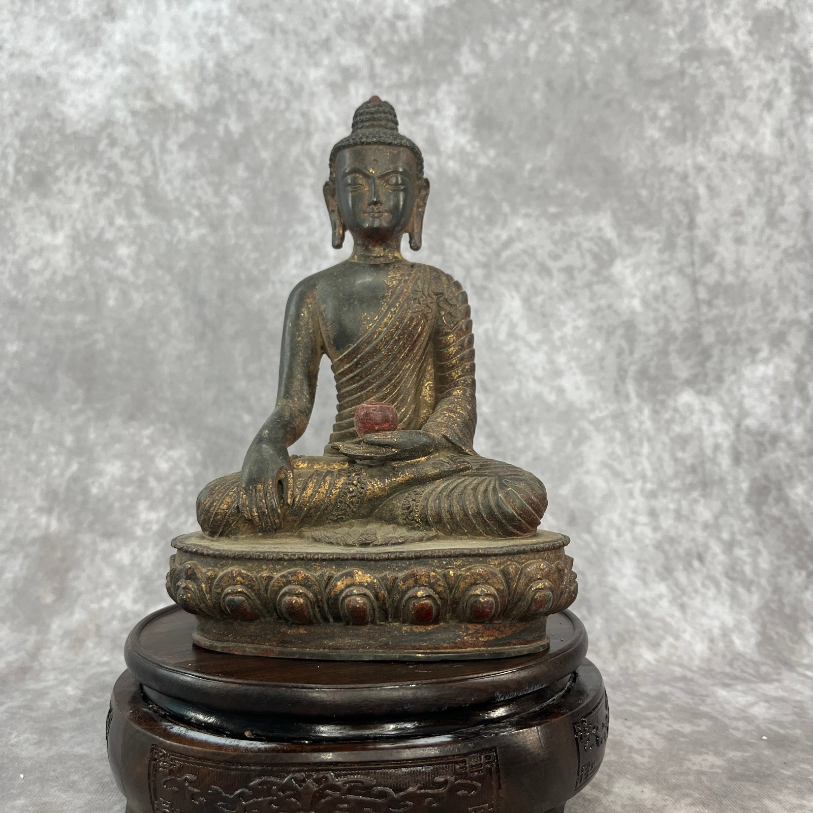 GILT-BRONZE STATUE OF THE MEDICINE BUDDHA: Qing Dynasty; Long: 5.2 inch; Width: 3.3 inch; High: 7.6 inch; Woodbase for picture and display only