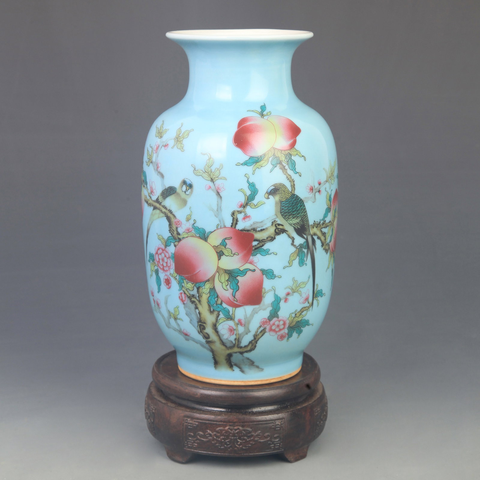 A BLUE GROUND FAMILLE ROSE FLOWER PATTERN PORCELAIN VASE: Qing Dynasty Qian Long Period; Diameter: High: 8.50 inch; Diameter: 4.50 inch; Woodbase for picture and display only