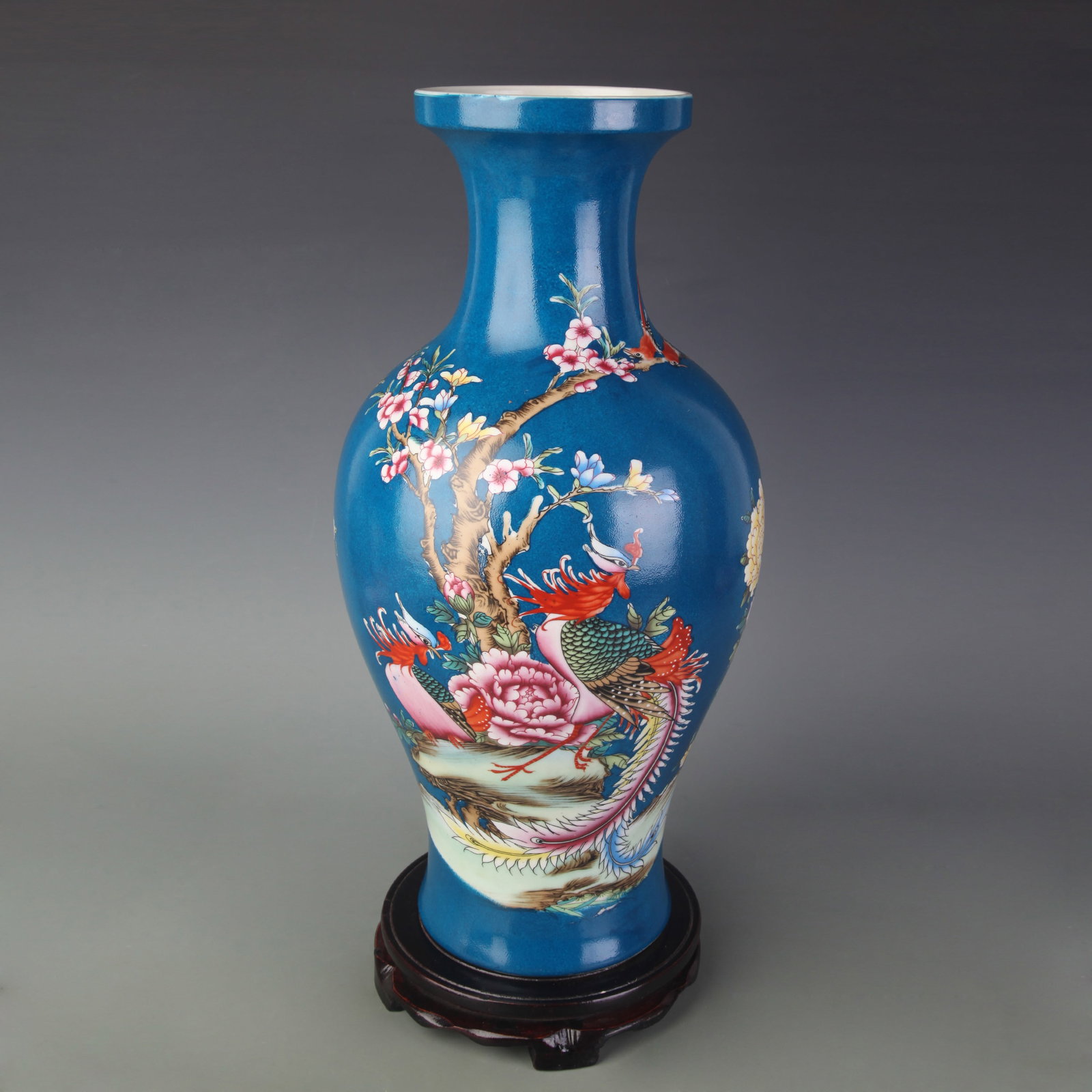 FAMILLE ROSE PEACOCK BLUE GROUND FLORAL AND PHOENIX DESIGN VASE: Qing Dynasty; High: 16.9 inch; Woodbase for picture and display only