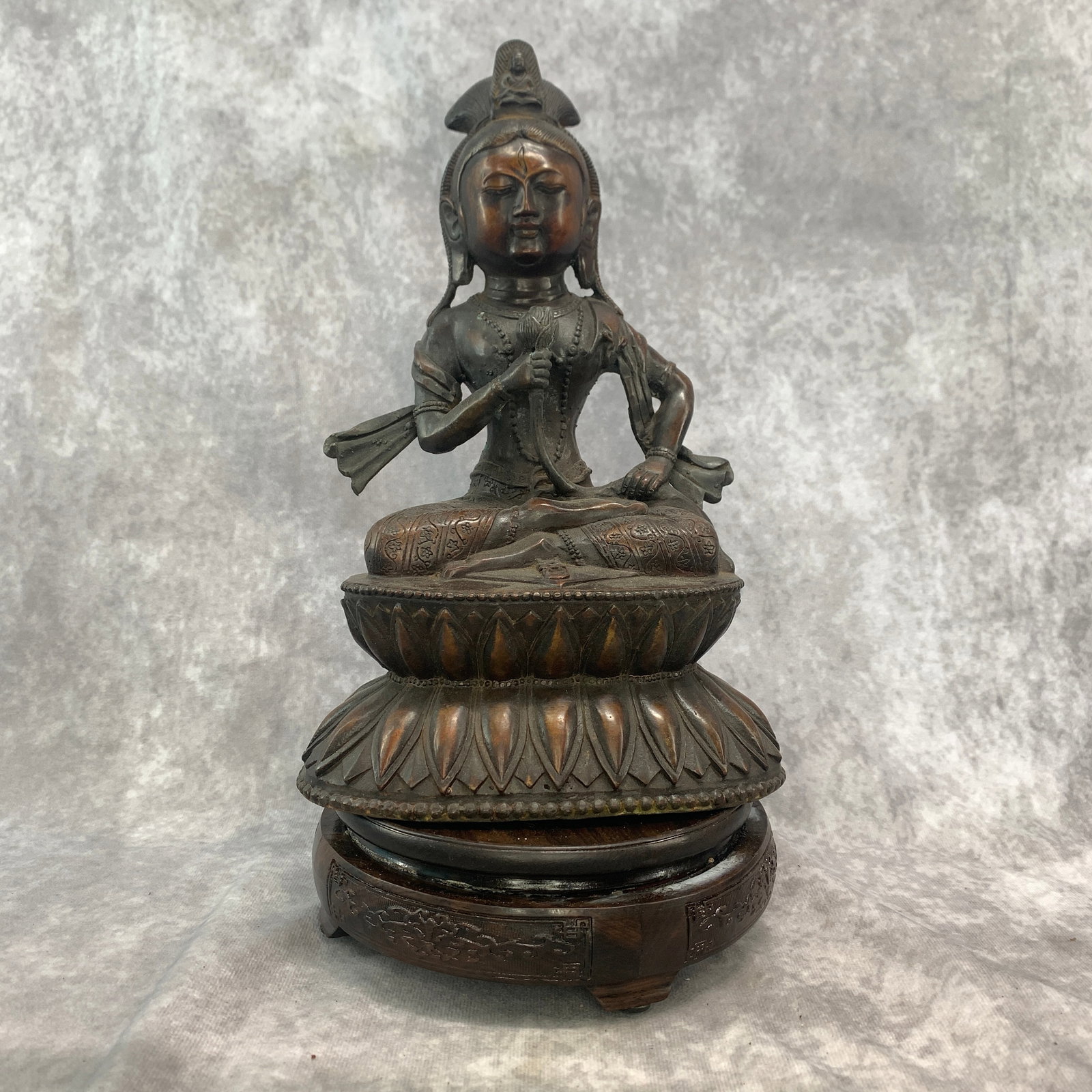 CHINESE BRONZE STATUE OF A SEATED GUANYIN (AVALOKITESHVARA): Qing Dynasty; Long: 6.8 inch; Width: 4.7 inch; High: 10.4 inch; Woodbase for picture and display only