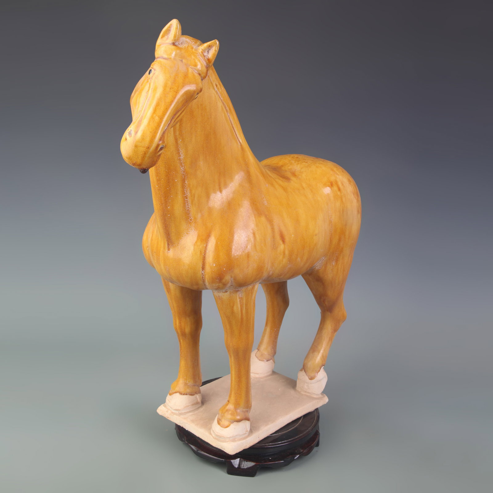 YELLOW-GLAZED TERRACOTTA FIGURE OF A STANDING HORSE: Tang Dynasty Style; Long:16.0 inch, High: 16.5 inch; Woodbase for picture and display only