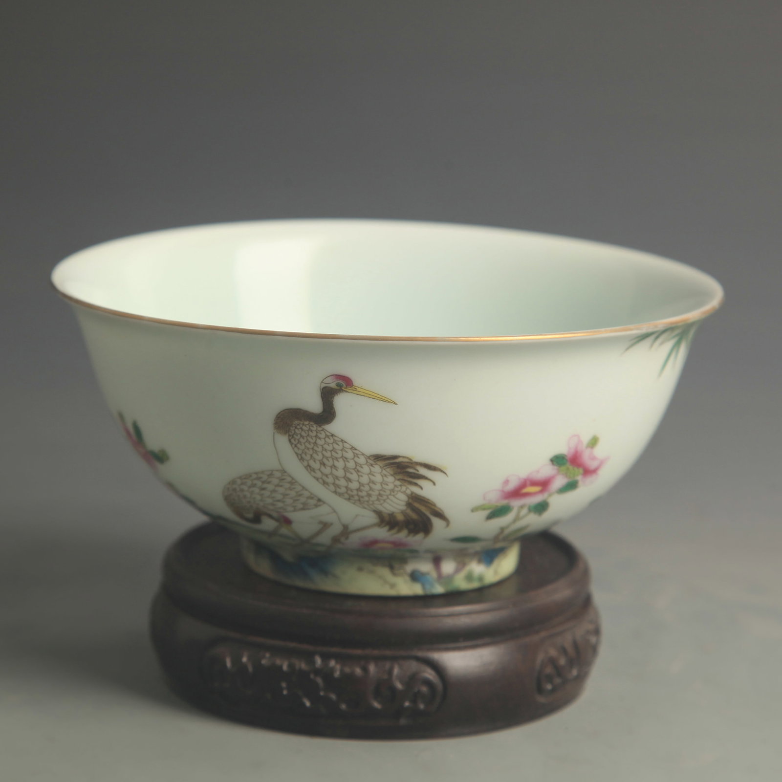 FAMILLE ROSE BOWL WITH BIRD, FLOWER AND LION MOTIFS: Qing Dynasty Qian Long Period; High: 2.60 inch; Diameter: 5.50 inch; Woodbase for picture and display only