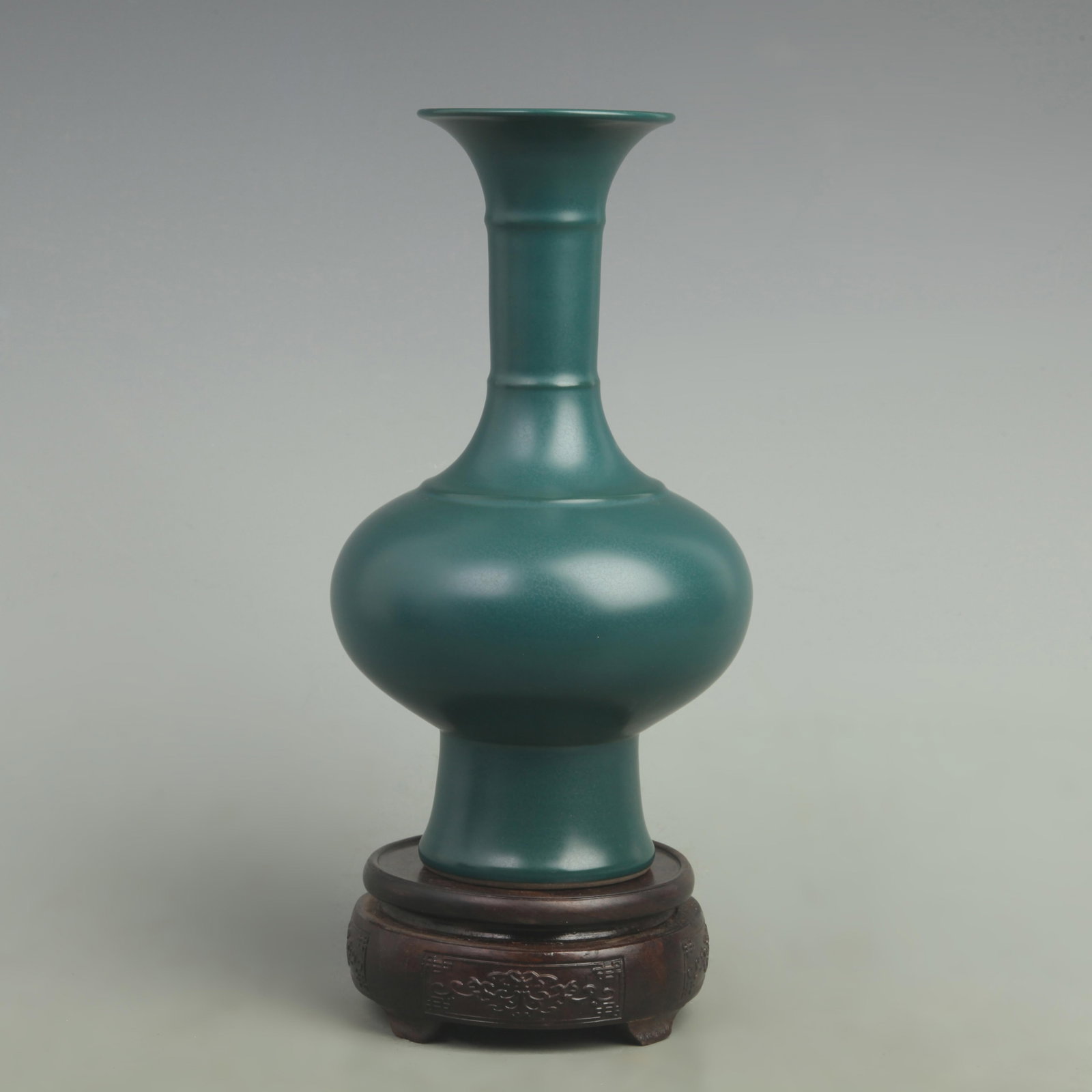 A FUBE PEACOCK-BLUE GLAZED FLATTENED PORCELAIN VASE: Qing Dynasty Yong Zheng Period; High: 9.3 inch; Width: 5.3 inch; Woodbase for picture and display only