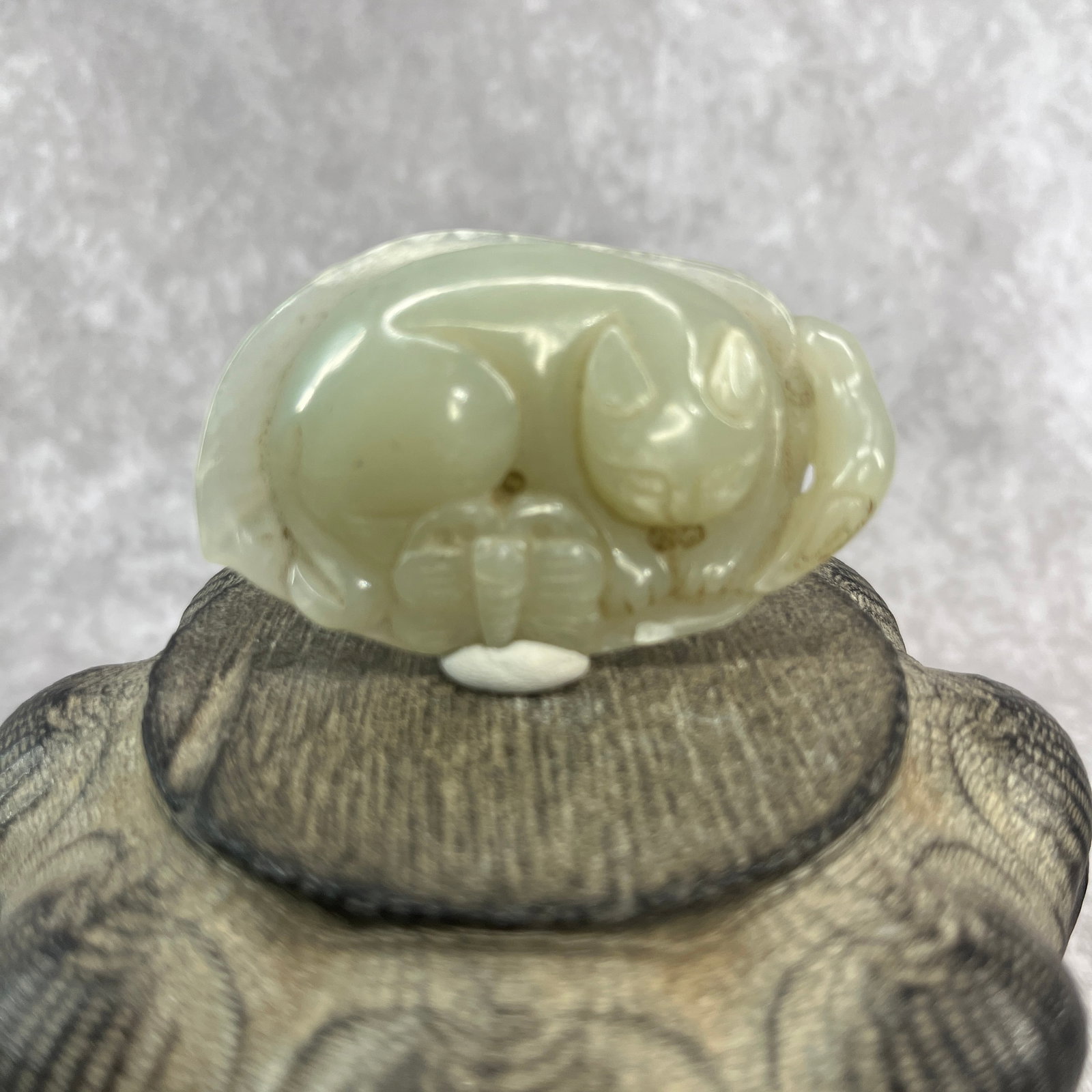 CHINESE HAND-CARVED JADE IN FIGURE OF SLEEPING CAT: Qing Dynasty; Long: 2.54 inch; Width: 1.6 inch; High: 0.63 inch; Woodbase for picture and display only