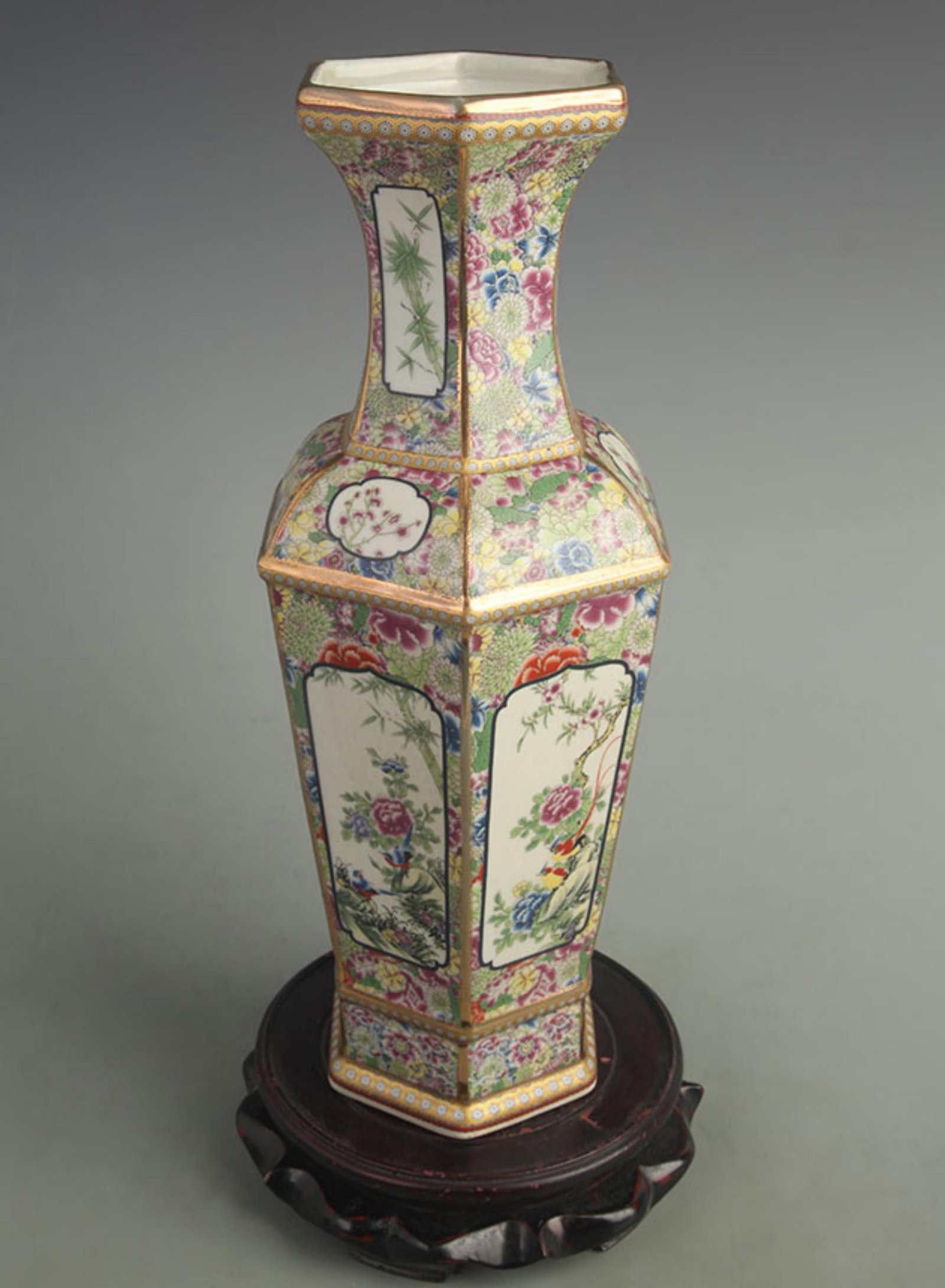 MULTICOLORED HEXAGONAL STYLE PORCELAIN VASE WITH BLOOMING FLOWERS: Qing Dynasty Qian Long Period; Diameter: High: 14.0 inch; Width: 5.00 inch; Woodbase for picture and display only