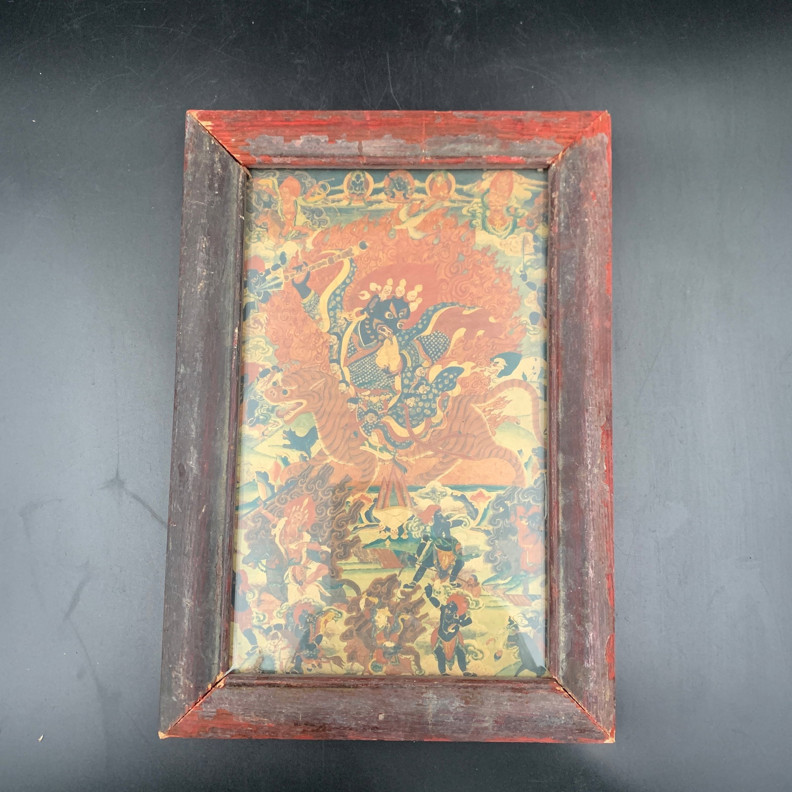 A FINE FRAMED TIBETAN PAINTING –WRATHFUL PROTECTOR DEITY (1 of 6)