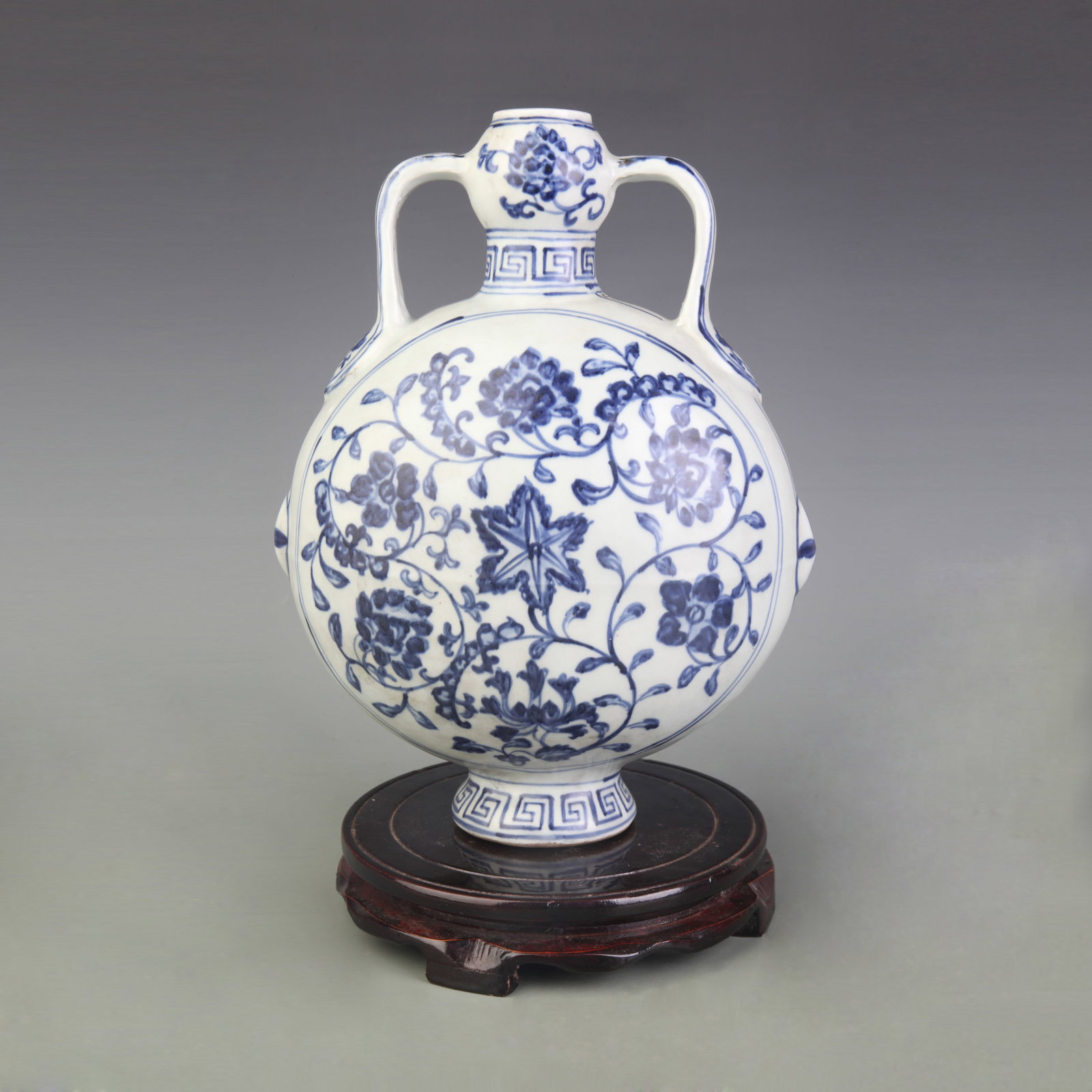 BLUE AND WHITE FLOWER PATTERN MOON STYLE PORCELAIN BOTTLE: Ming Dynasty Style; Width: 7.7 inch; High: 11 inch; Woodbase for picture and display only