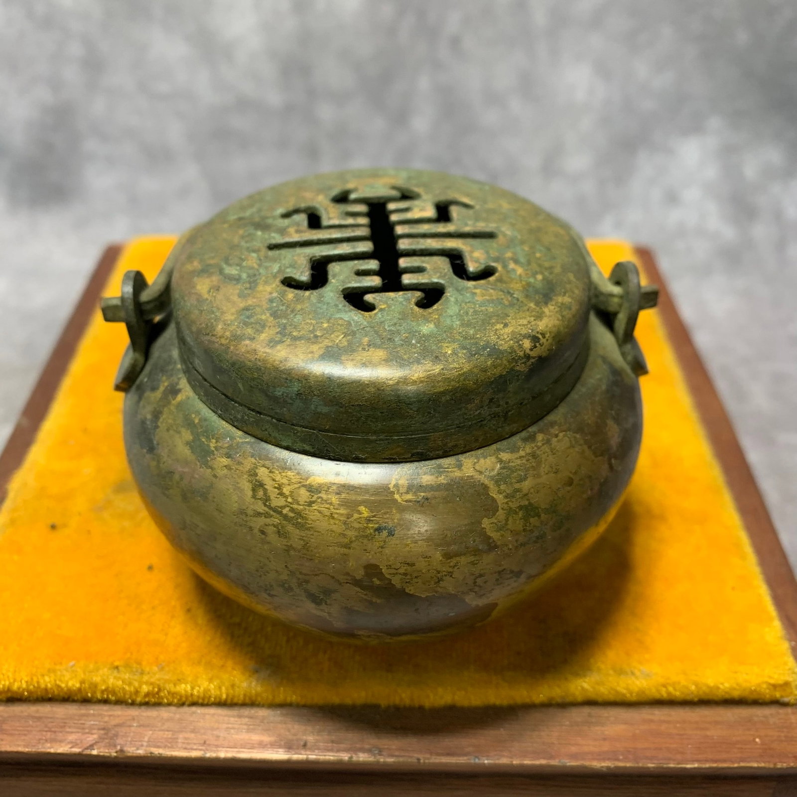 BRONZE INCENSE BURNER WITH ENGRAVED AUSPICIOUS BEAST HANDLE: Qing Dynasty; High: 3.9 inch; Diameter: 3.4 inch; Woodbase for picture and display only
