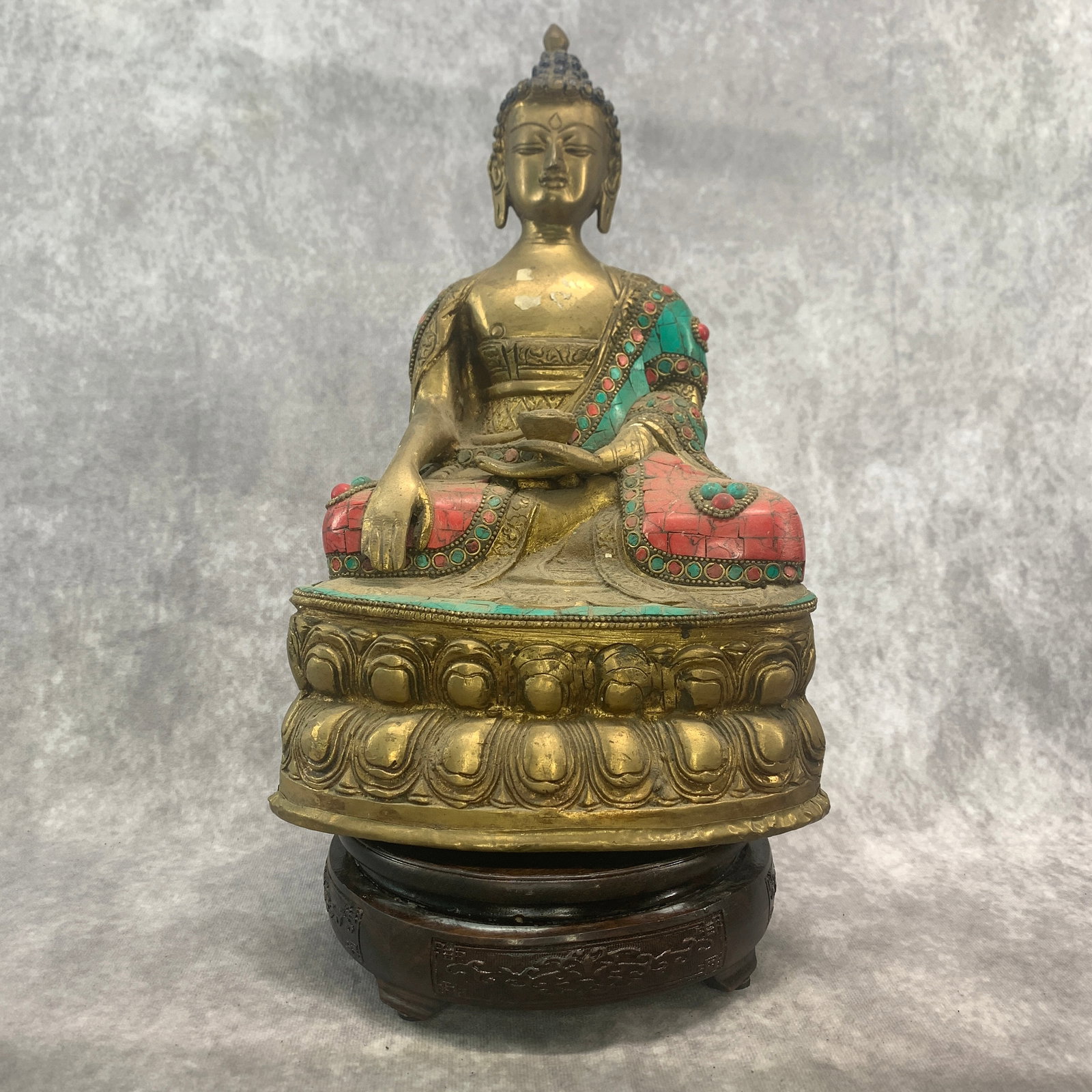 TIBETAN BRONZE STATUE OF SHAKYAMUNI BUDDHA WITH TURQUOISE STONES: Qing Dynasty; Long: 7.8 inch; Width: 4.8 inch; High: 12.3 inch; Woodbase for picture and display only