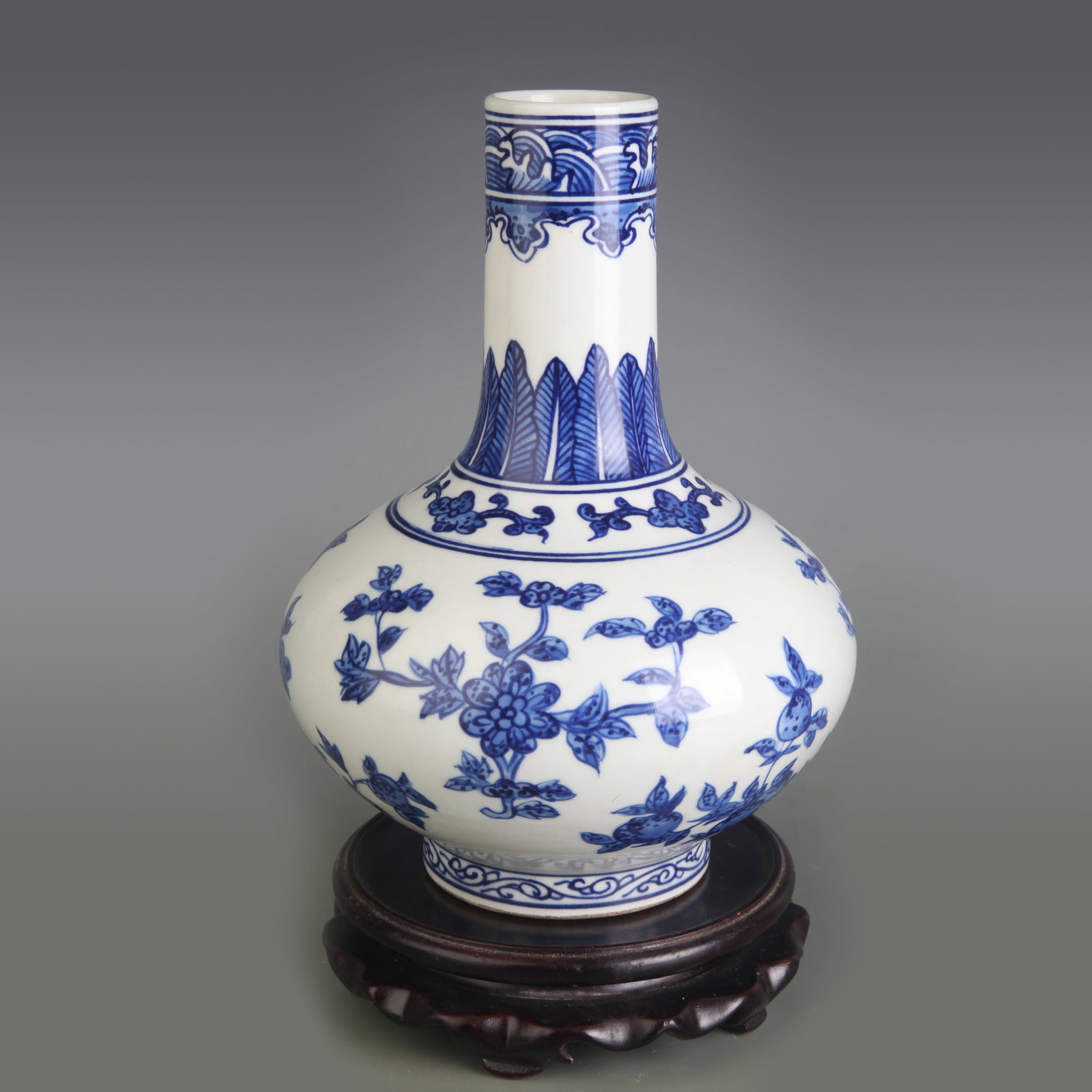 BLUE AND WHITE FLOWER AND FRUIT FLAT-BELLY STYLE PORCELAIN VASE: Qing Dynasty Qian Long Period; Diameter: 1.7 inch; High: 8.0 inch; Woodbase for picture and display only