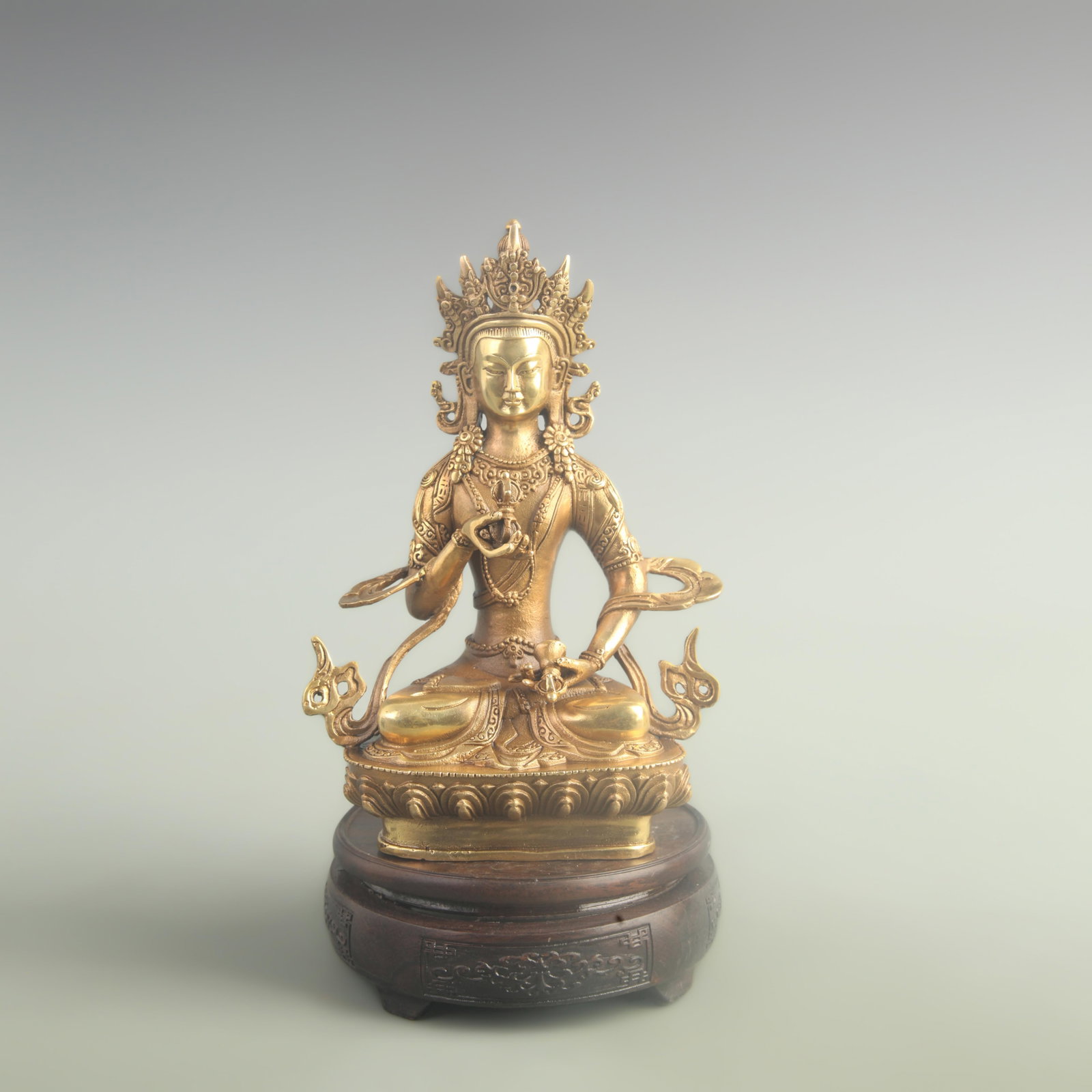 A FINE GILDED BRONZE VAJRASATTVA STATUE: 20th Century; High: 8.20 inch; Width: 2.20 inch; Long: 4.00 inch; Woodbase for picture and display only