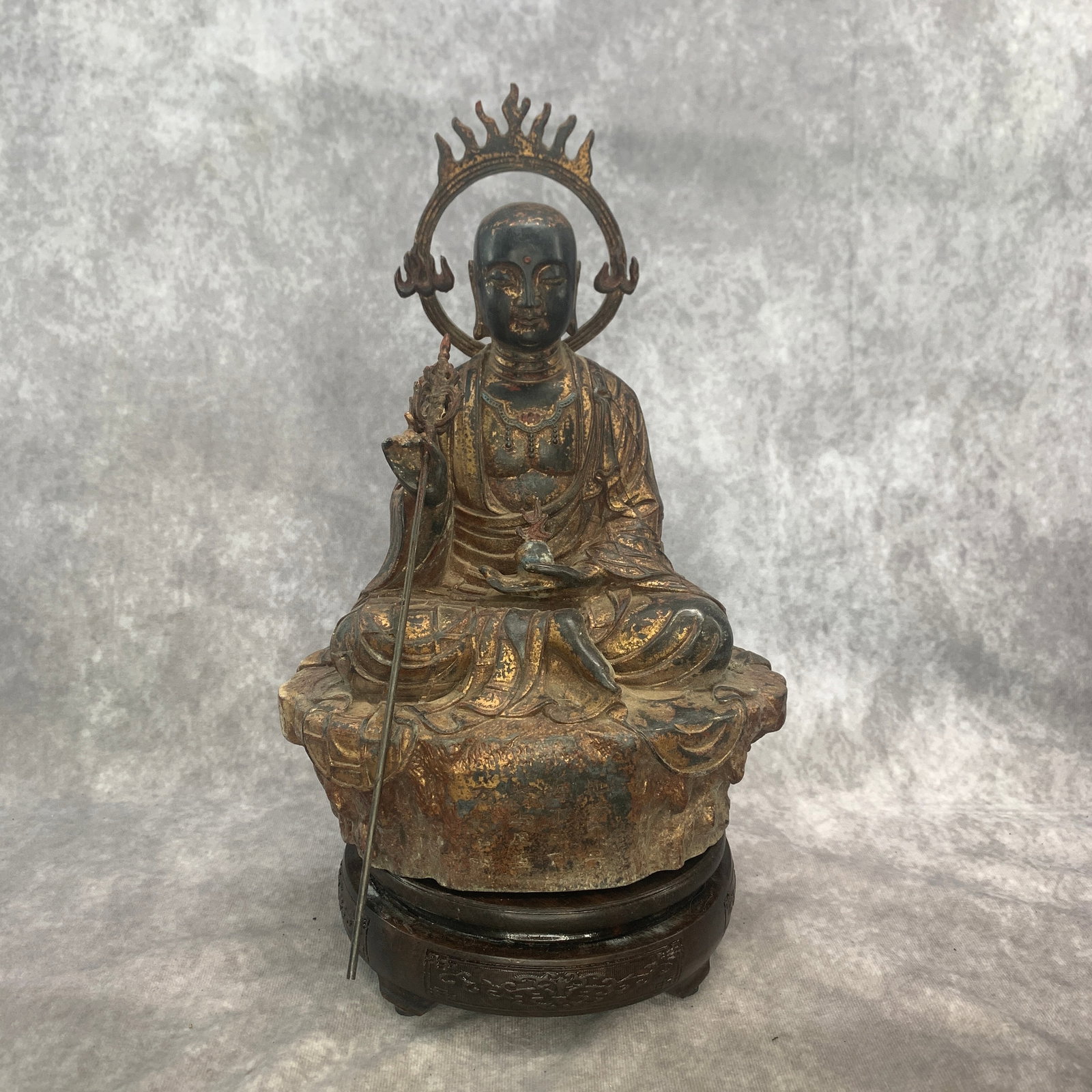 A FINE GILT-BRONZE FIGURE OF THE BODHISATTVA KSITIGARBHA: Qing Dynasty; Long: 7.8 inch; Width: 5.7 inch; High: 11.7 inch; Woodbase for picture and display only