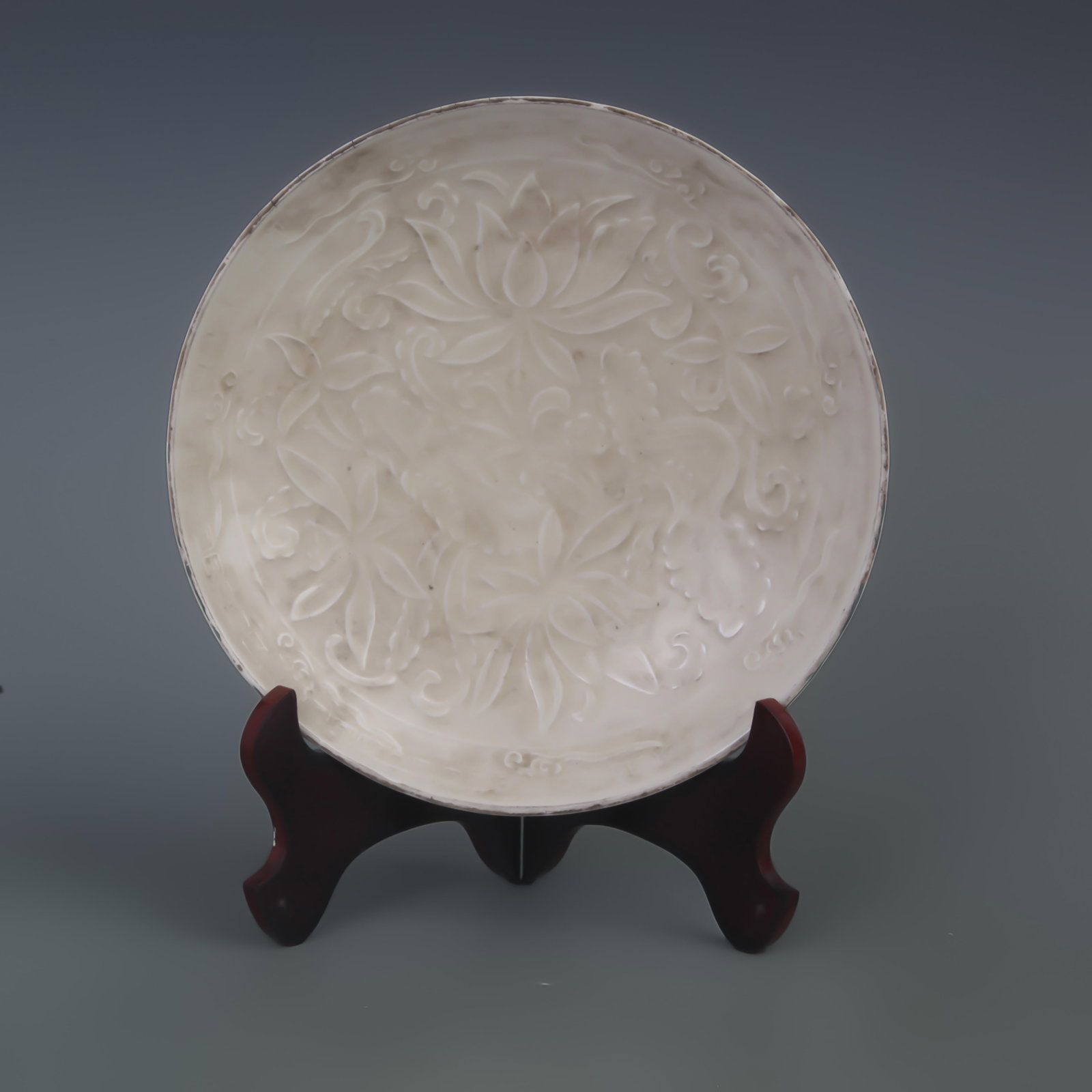 DING KILN CARVED FLORAL PATTERN PORCELAIN PLATE: Song Dynasty Style; Diameter: 8.8 inch; High: 1.7 inch; Woodbase for picture and display only