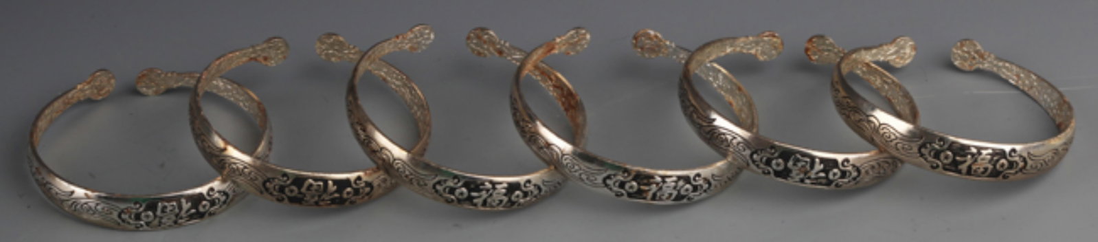 GROUP OF FINELY CARVED SILVER PLATED BANGLES (1 of 4)
