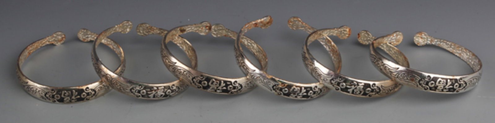 GROUP OF FINELY CARVED SILVER PLATED BANGLES (1 of 4)