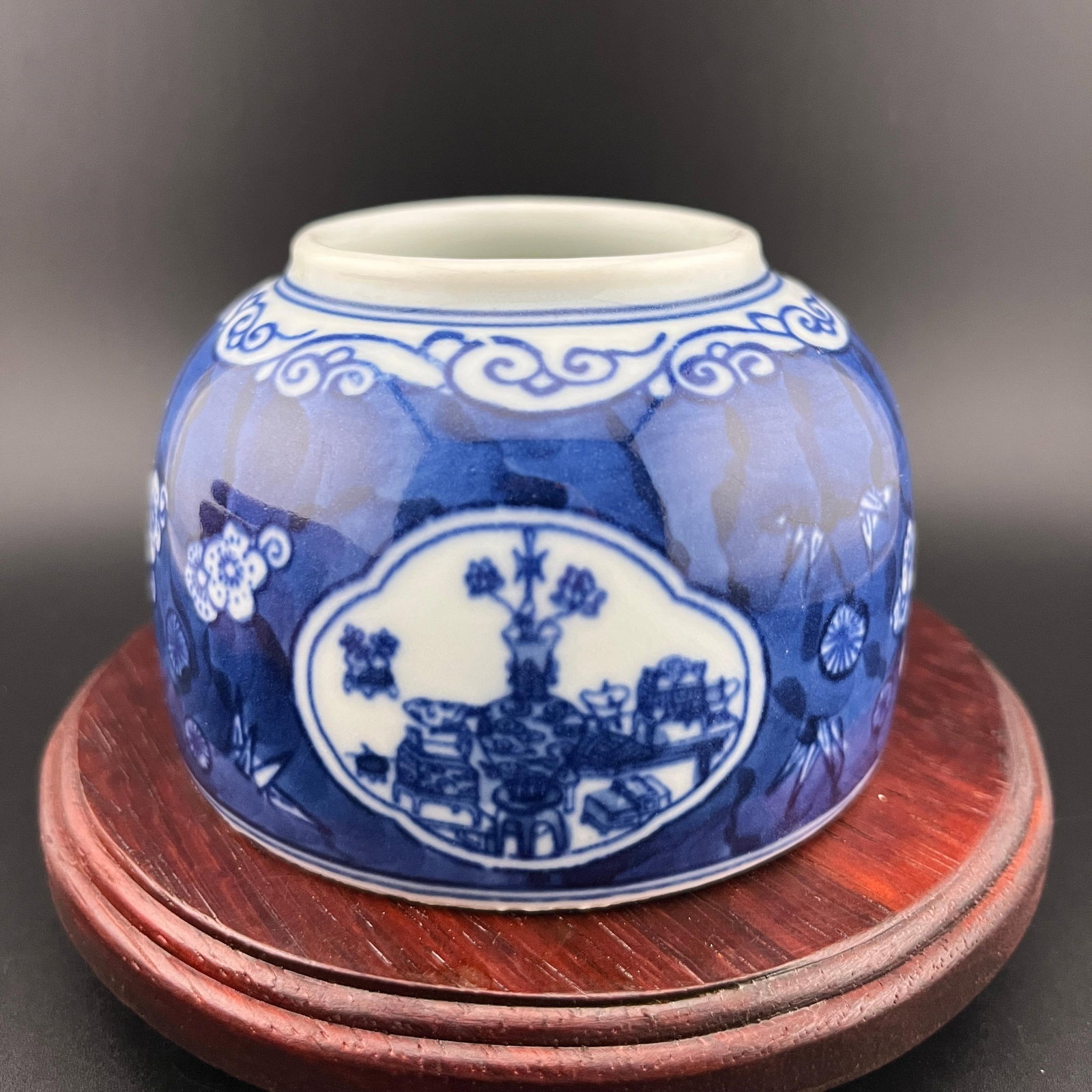 BLUE GROUND "HUNDRED ANTIQUES" PORCELAIN SCHOLAR'S INK COUPE: Qing Dynasty; High: 2.4 inch; Diameter: 3.7 inch; Woodbase for picture and display only