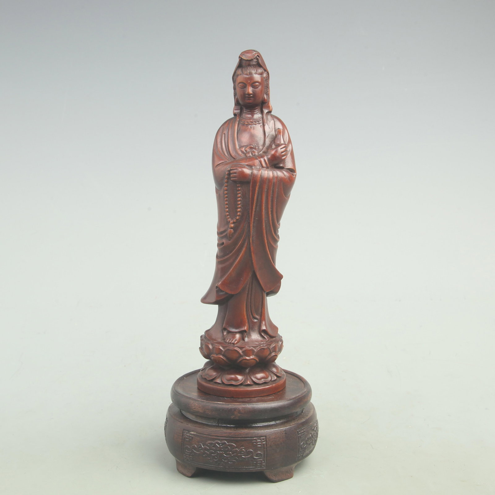 A FINE BOXWOOD IN FIGURE OF GUAN YIN BUDDHA: Qing Dynasty; Height;8.3 inch; Width: 2.4 inch; Woodbase for picture and display only