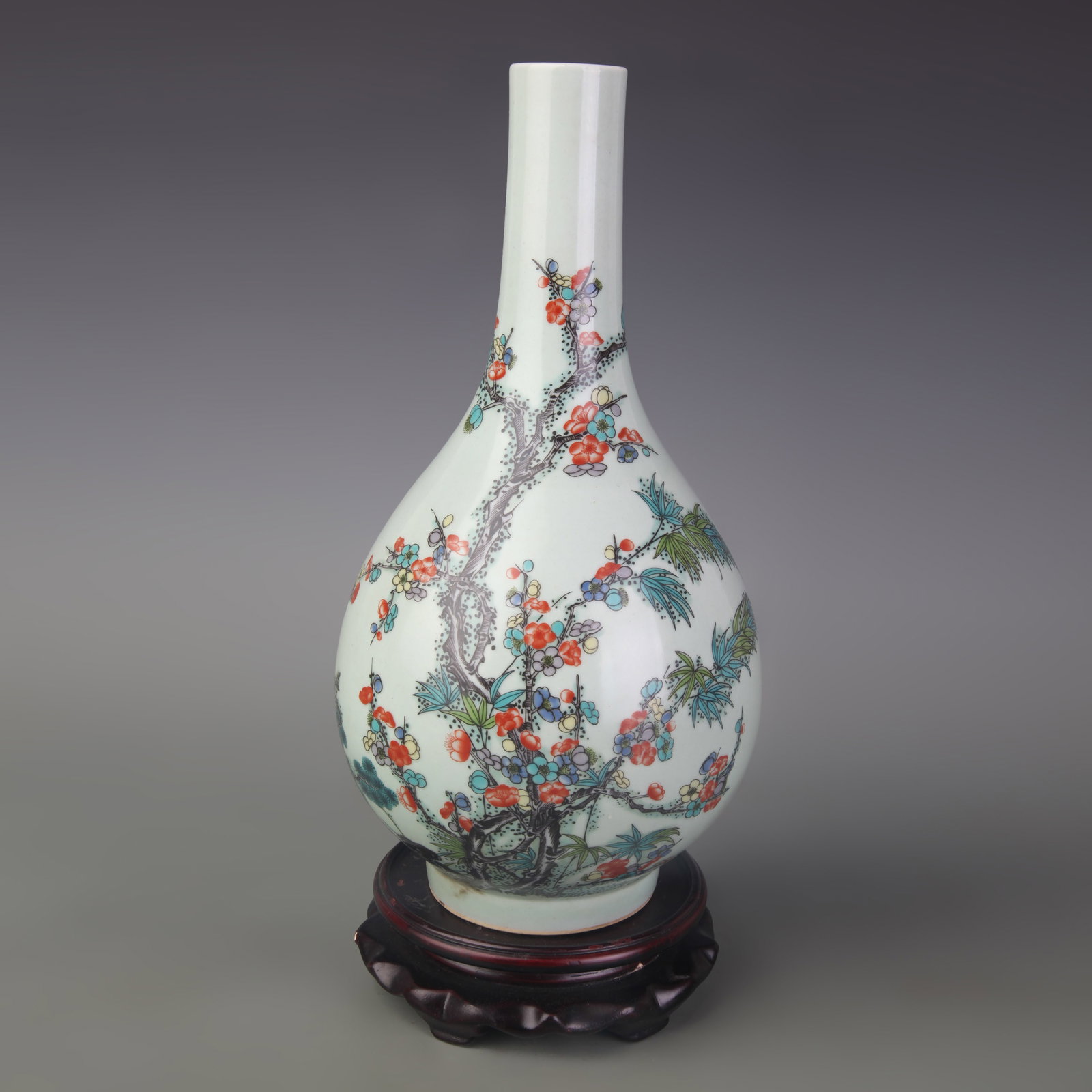 A FAMILLE-ROSE FLORAL AND BIRD GALLBLADDER VASE: Qing Dynasty Qian Long Period; Diameter: 3.2 inch; High: 11.1 inch. Wooden base for display only