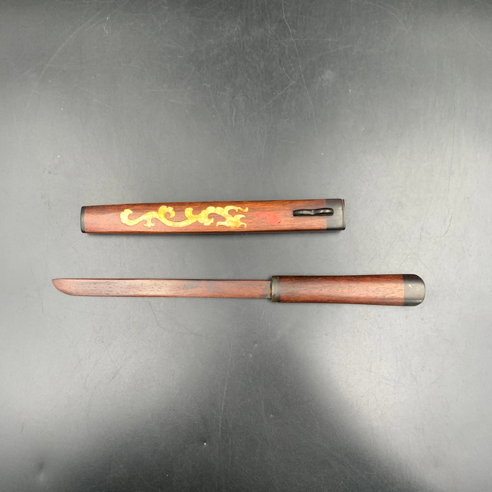 HARDWOOD SCHOLAR'S LETTER OPENER: Republic Period; Long: 12 inch; Width: 0.9 inch; High: 0.9 inch; . Wooden base for display only