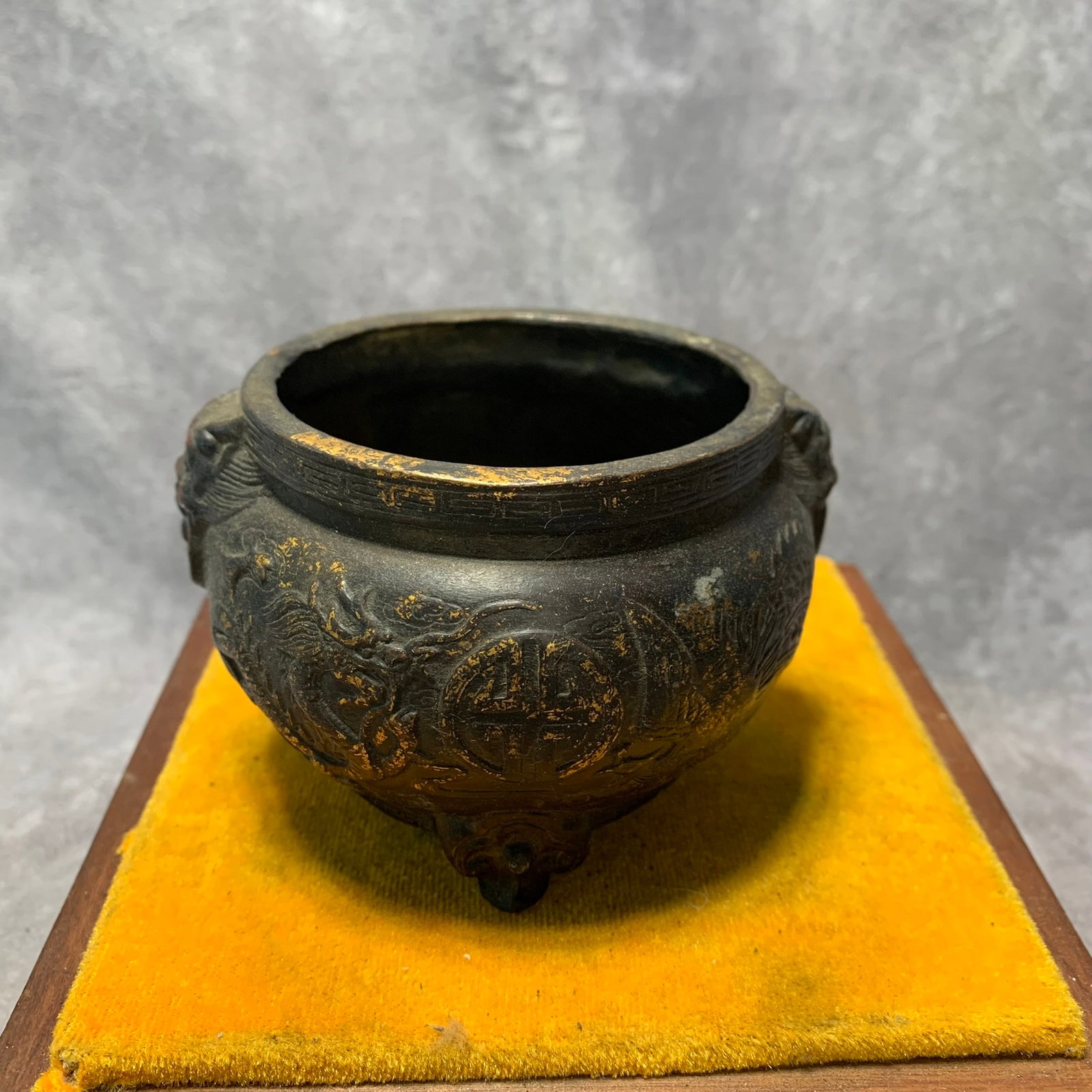 KANGXI MARK BRONZE GILDED DRAGON AND PHOENIX DESIGN LION-EAR INCENSE BURNER: Qing Dynasty; High: 2.9 inch; Diameter: 4.1 inch. Wooden base for display only