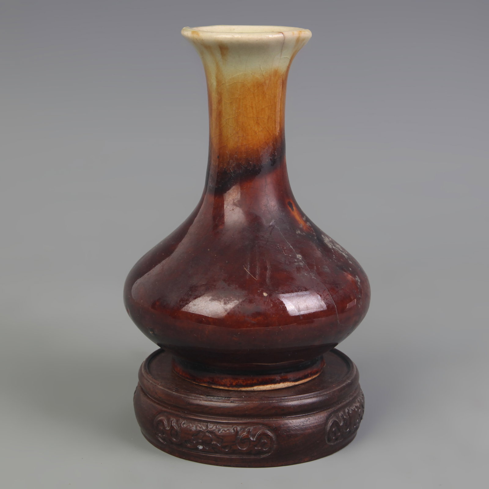 TRANSMUTATION-GLAZED SMALL PORCELAIN VASE: Qing Dynasty; Diameter: 2.6 inch; Width: 4.5 inch; High: 5.5 inch. Wooden base for display only