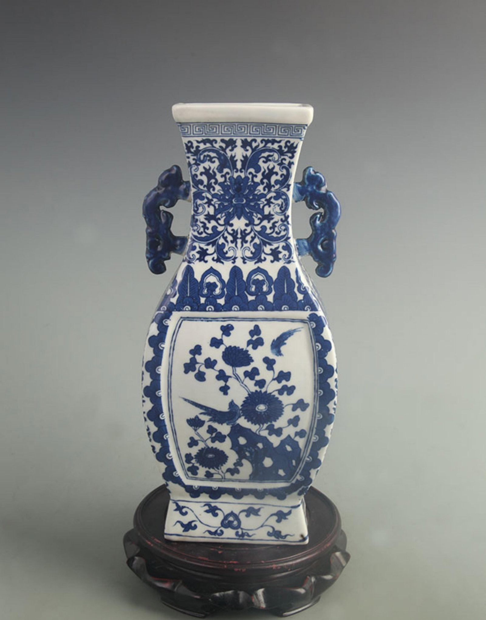 BLUE AND WHITE DOUBLE-HANDLED SQUARE VASE WITH FLORAL AND BIRD MOTIFS: Qing Dynasty Qian Long Period; High: 12.1 inch; Width: 5.30 inch; . Wooden base for display only