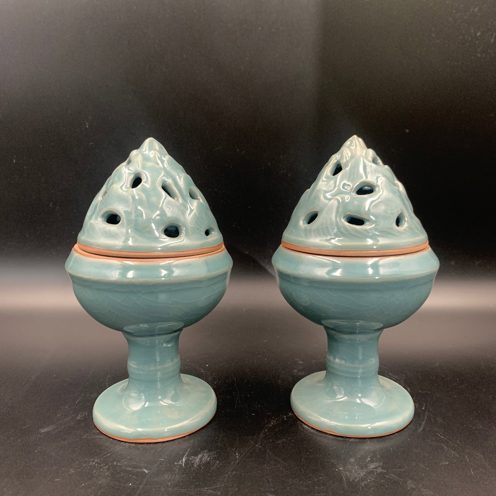 PAIR OF CELADON COLOR GLAZED MOUNTAIN HILL CENSERS: High: 6.9 inch; Diameter: 4 inch; . Wooden base for display only