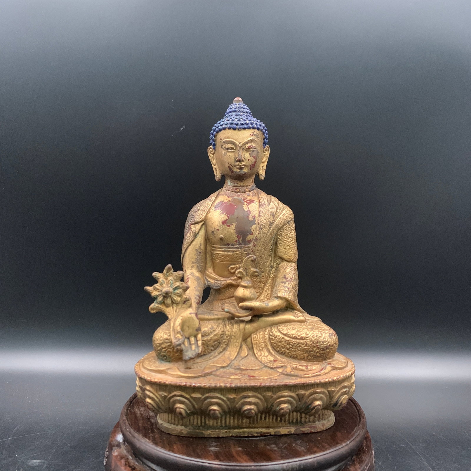 RARE GILT BRONZE MEDICINE BUDDHA STATUE (BHAISAJYAGURU): Qing Dynasty; Long: 5.1 inch; Width: 3.7 inch; High: 7.9 inch; . Wooden base for display only