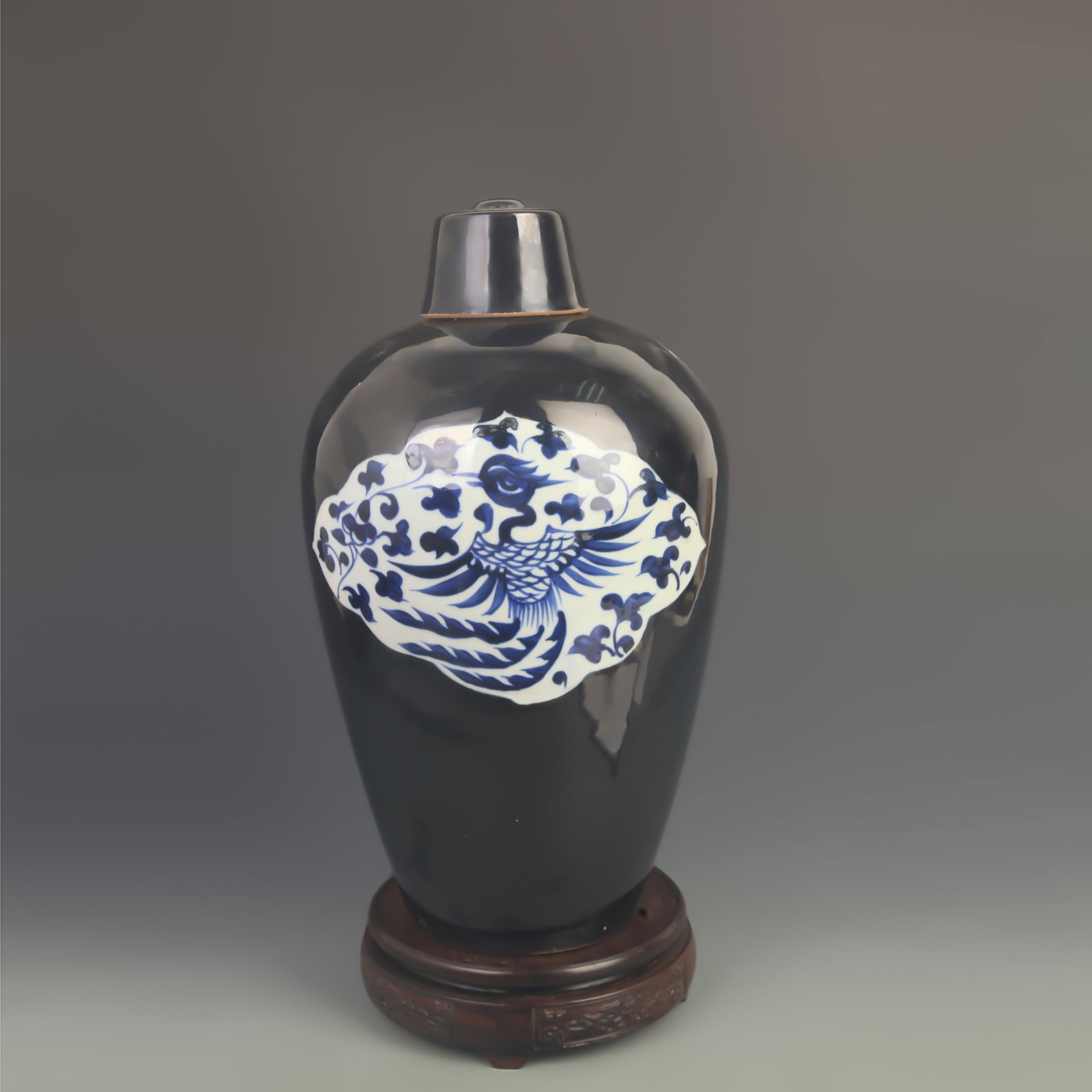 BLACK-GROUND OPEN-PANEL LIDDED MEIPING PORCELAIN VASE: Yuan Dynasty Style; High: 13.5 inch; Diameter: 7.50 inch; . Wooden base for display only