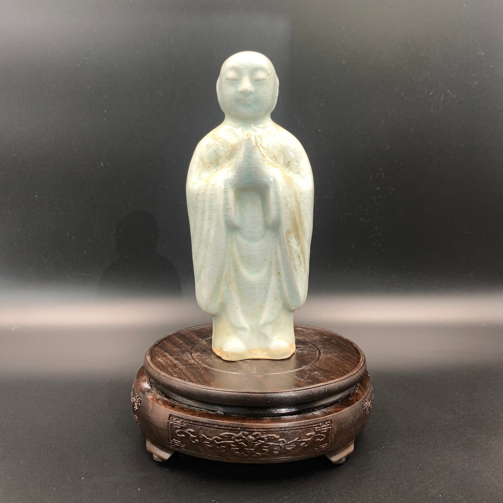 CELADON COLOR GLAZED STANDING MONK STATUE: Yuan Dynasty Style; Long: 3.4 inch; Width: 2.4 inch; High: 8.1 inch; . Wooden base for display only