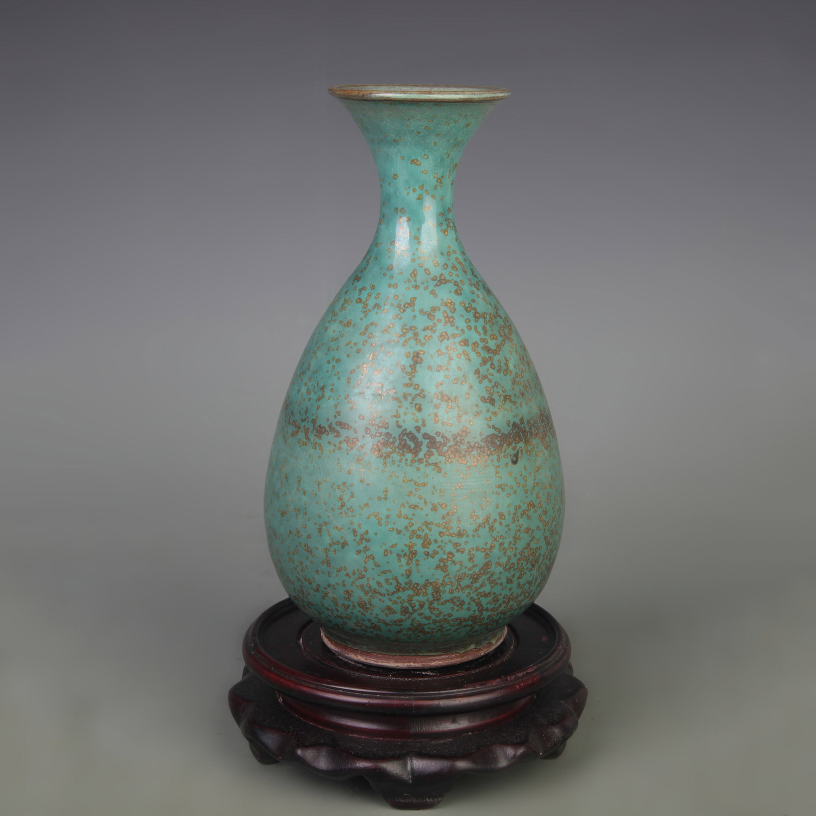 A JUN KILN YUHUCHUN PORCELAIN VASE: Song Dynasty Style; High: 8.0 inch; Diameter: 2.5 inch. Wooden base for display only