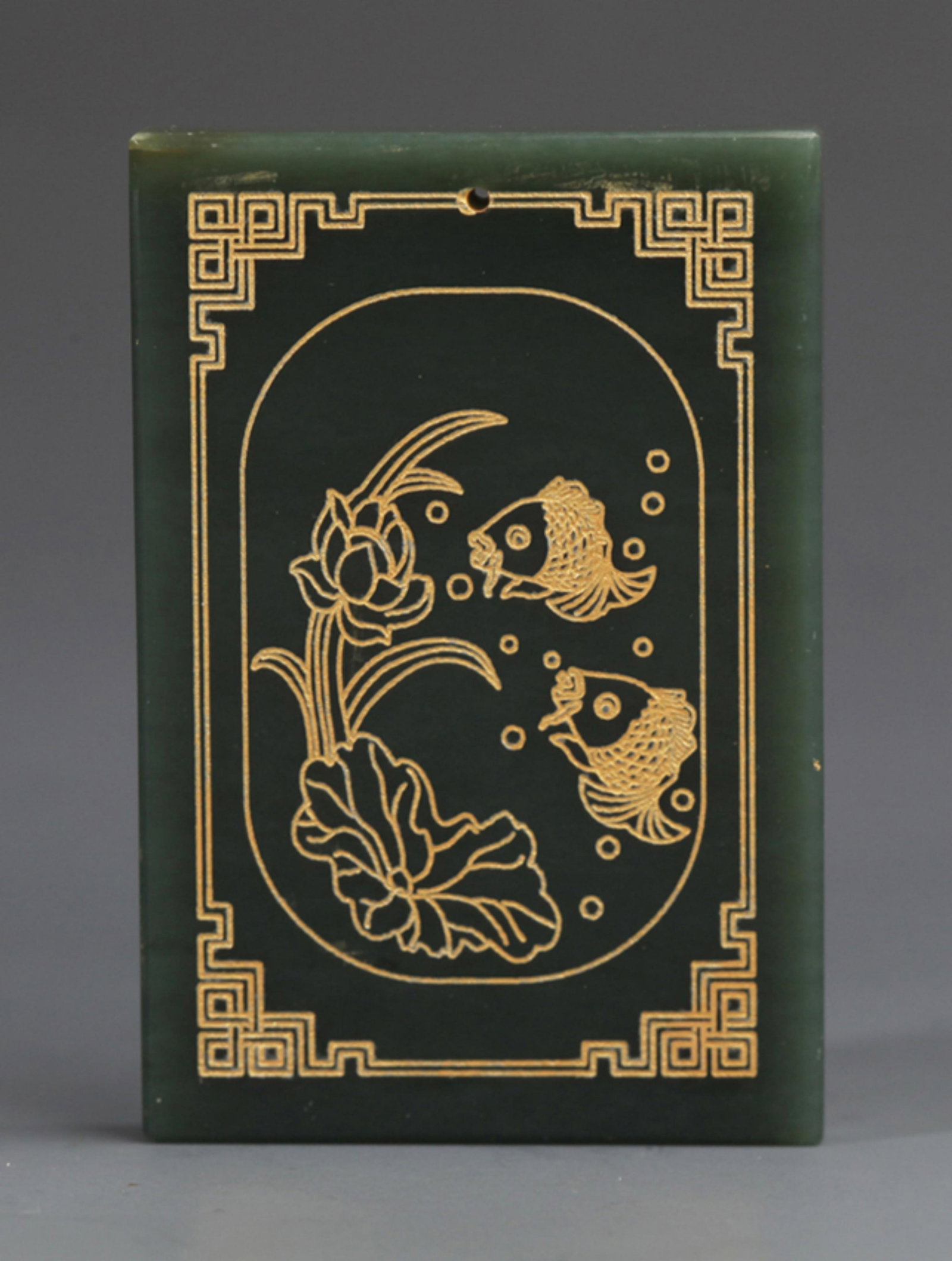 A FINE FISH CARVING CELADON JADE PENDANT: Modern; Long: 2.36 inch; Width: 1.57 inch; . Wooden base for display only