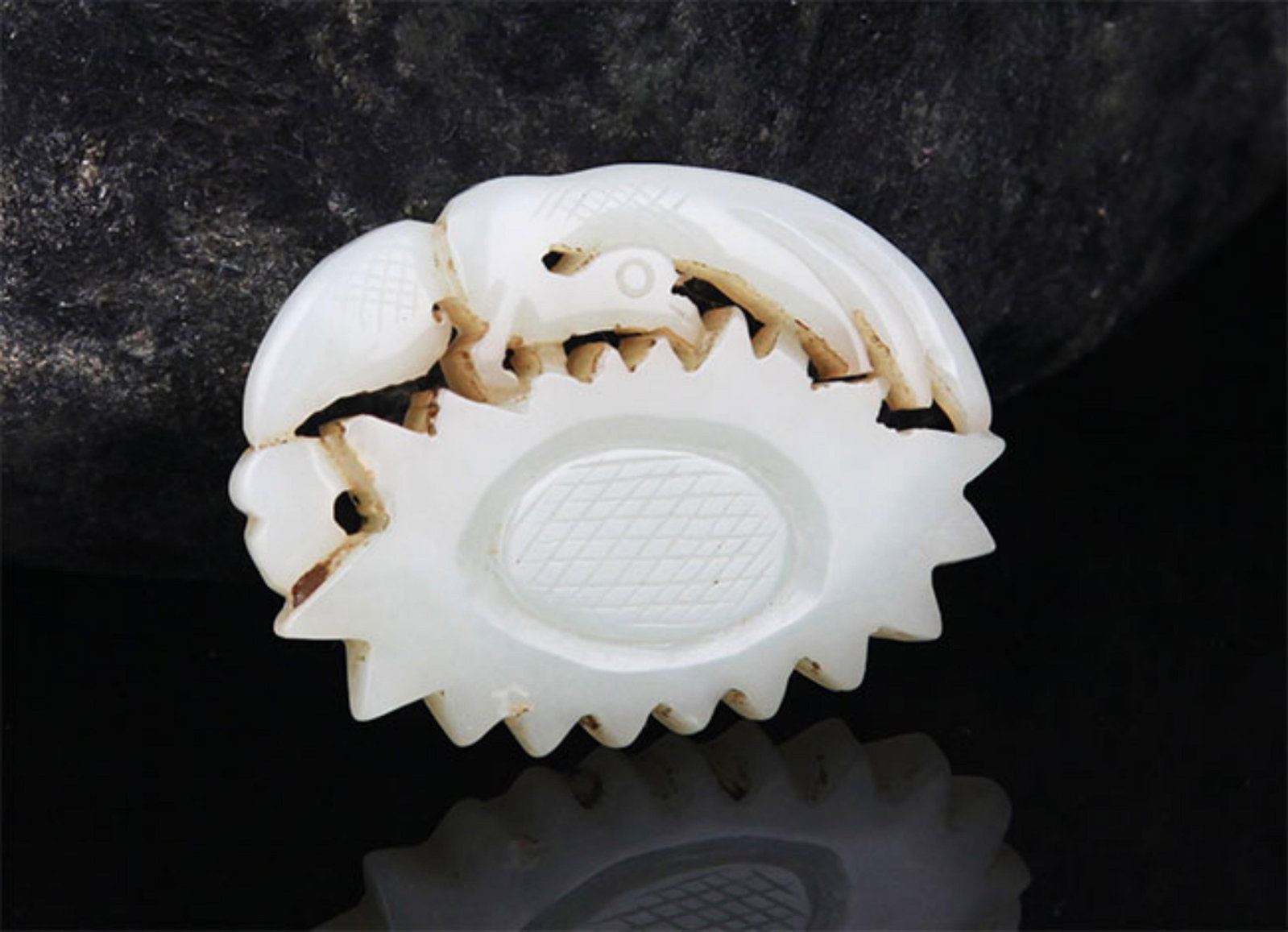 A FINE BIRD CARVING PALE CELADON JADE PENDANT: 20th Century; High: 1.25 inch; Width: 1.75 inch; . Wooden base for display only