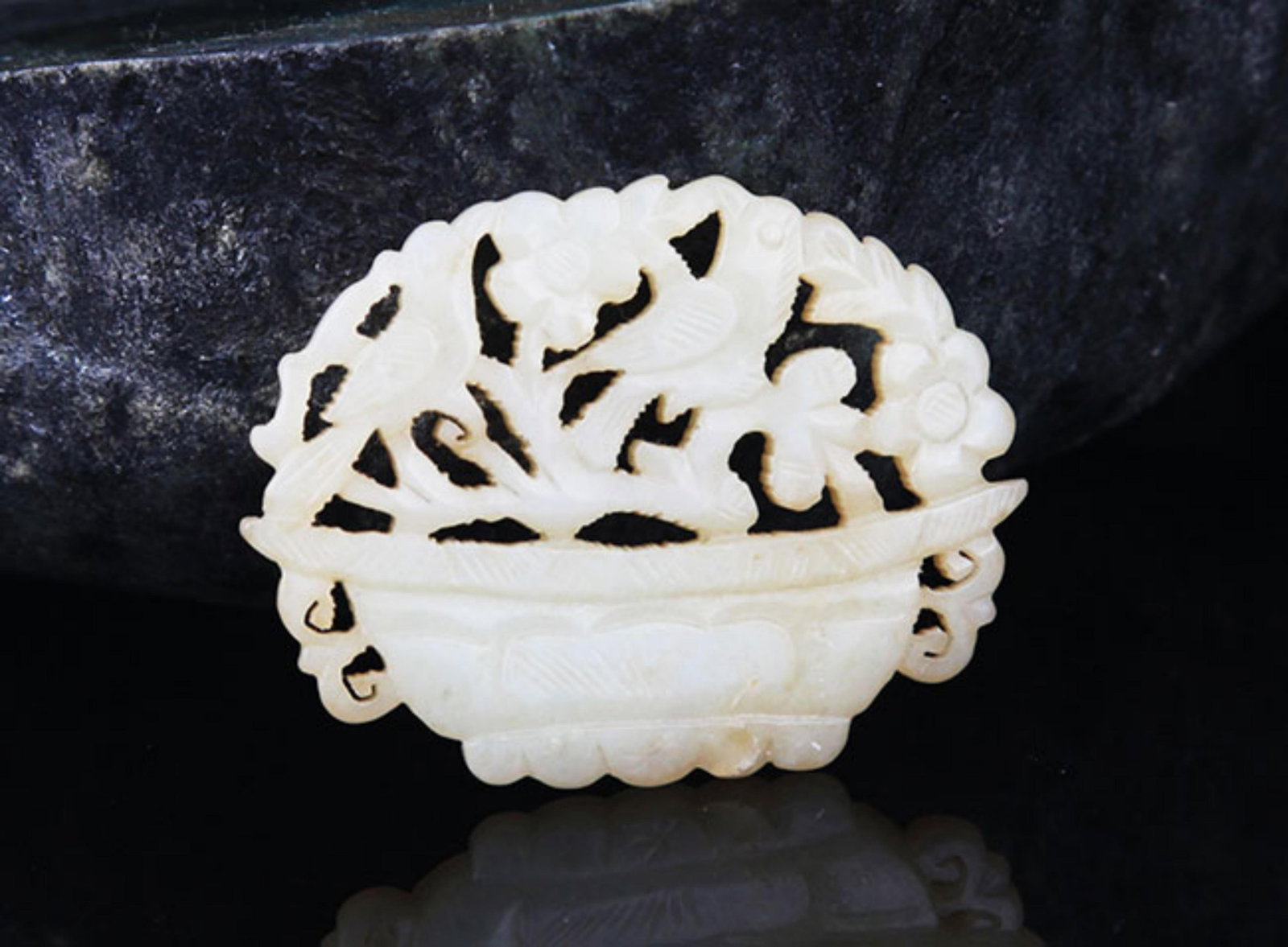 A FINE HE TIAN JADE IN FIGURE OF FLOWER BASKET: 20th Century; High: 1.3 inch; Width: 1.75 inch; . Wooden base for display only
