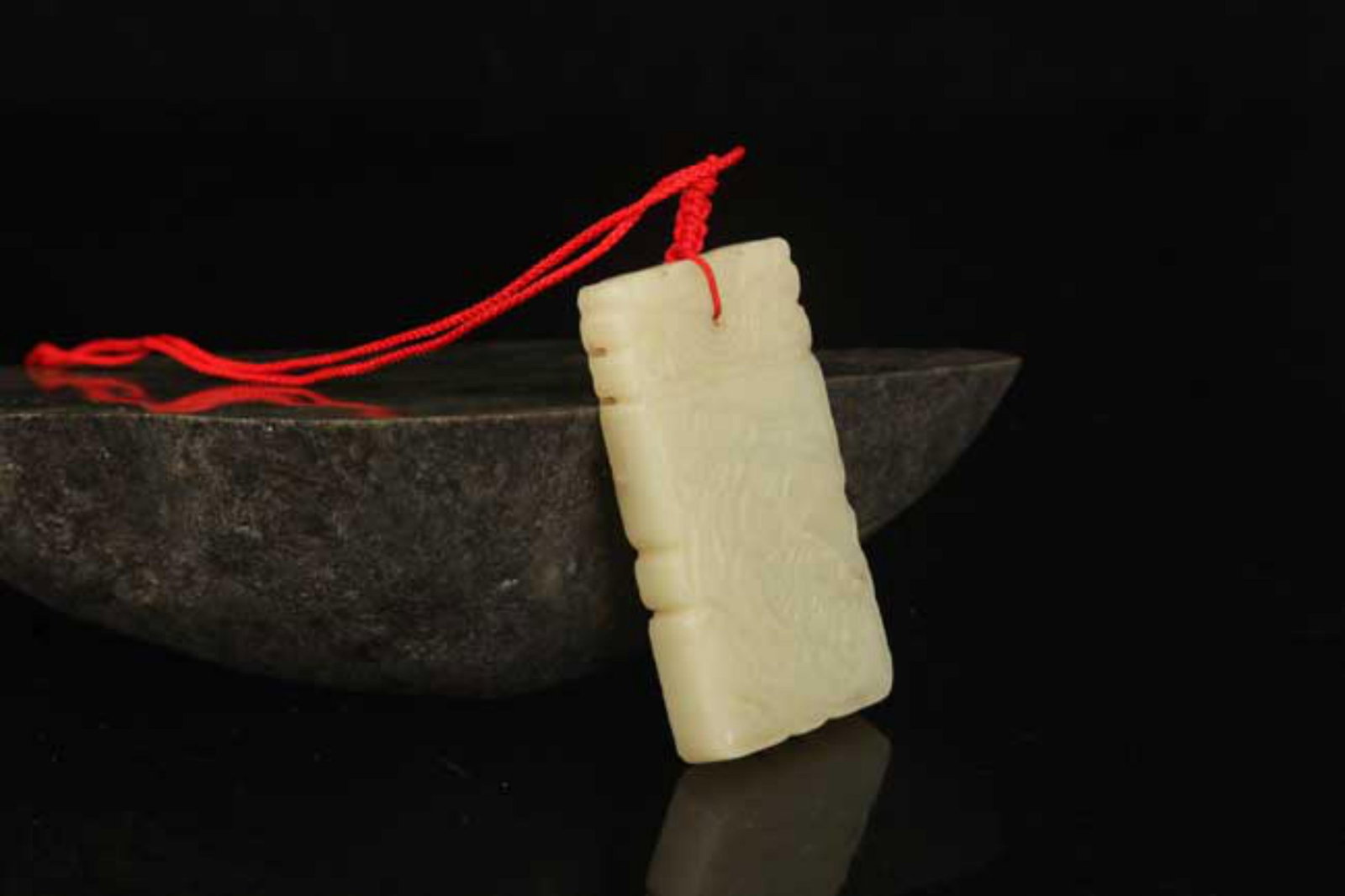 A FINE HETIAN BOY FIGURE JADE PENDANT: Modern; High: 2.5 inch; Diameter: 1.3 inch; . Wooden base for display only