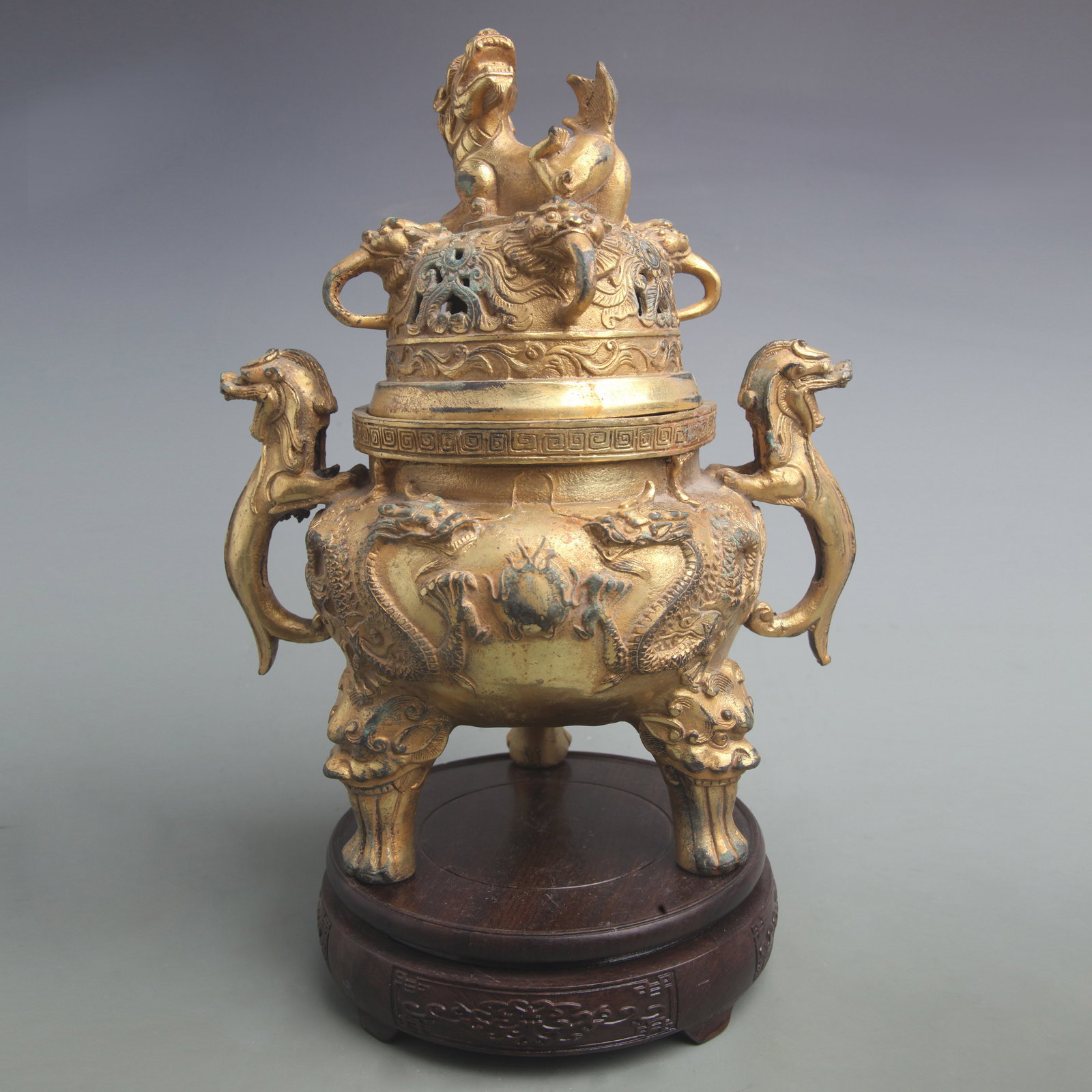 TRIPOD INCENSE BURNER WITH DRAGON DESIGN AND LONGEVITY KNOB: Qing Dynasty; Diameter: 8.5 inch; High: 10.8 inch; . Wooden base for display only