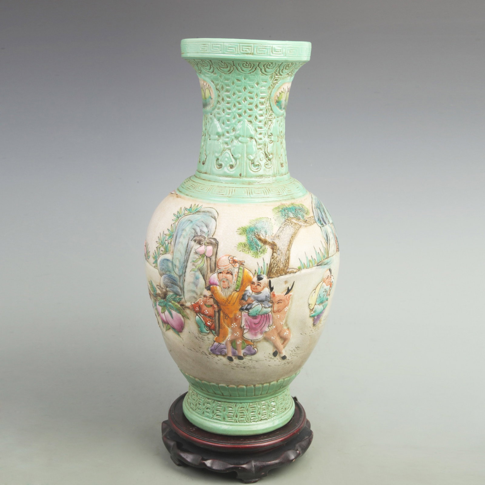 FAMILLE ROSE CARVED VASE WITH BOY OFFERING LONGEVITY DESIGN: Qing Dynasty Qian Long Period: High: 16.8 inch; Width: 9.5 inch;. Wooden base for display only