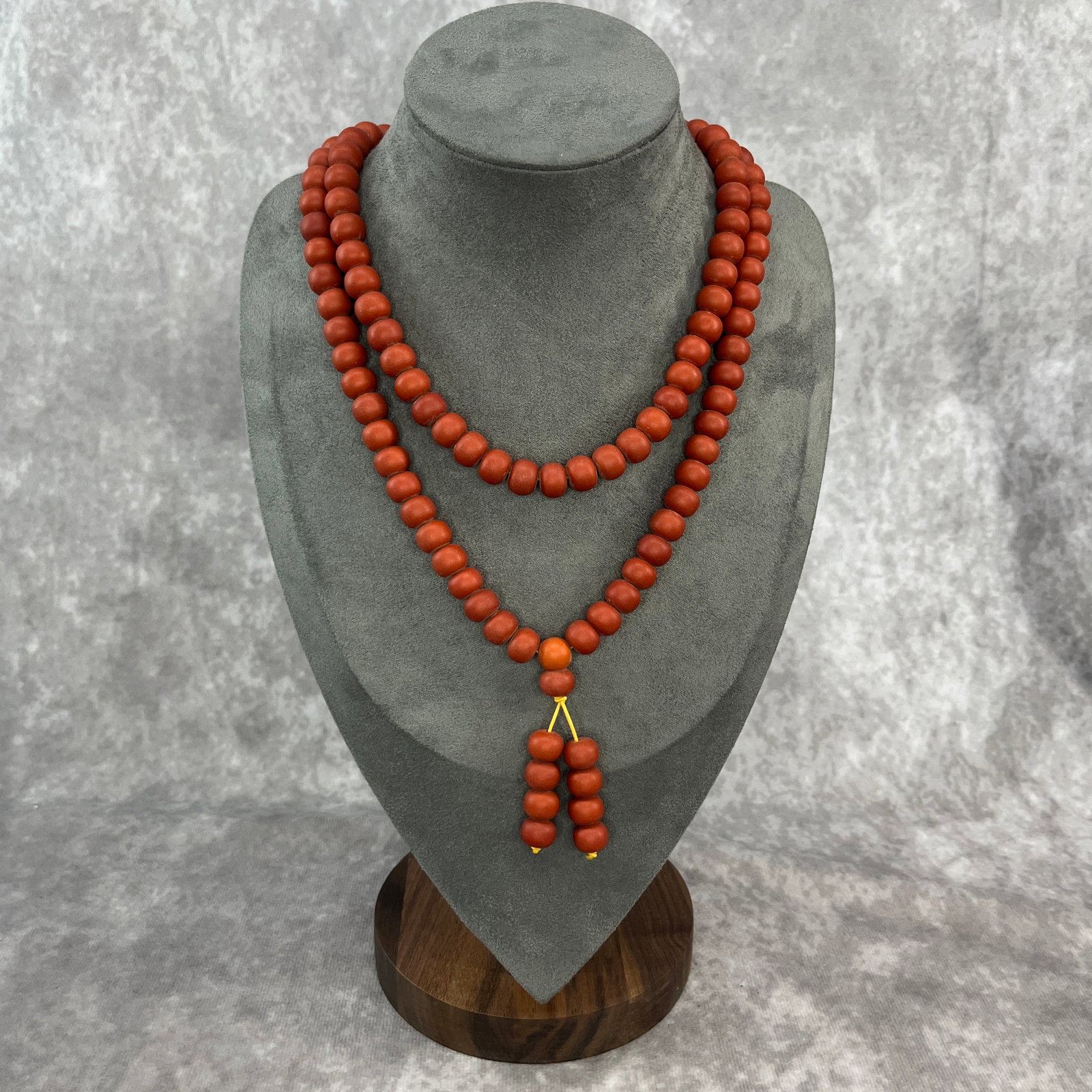 A FINE REB PAINTED WOOD MADE PRAYER NECKLACE: Modern; Long: 17.7 inch; Diameter: 0.38 inch. Wooden base for display only