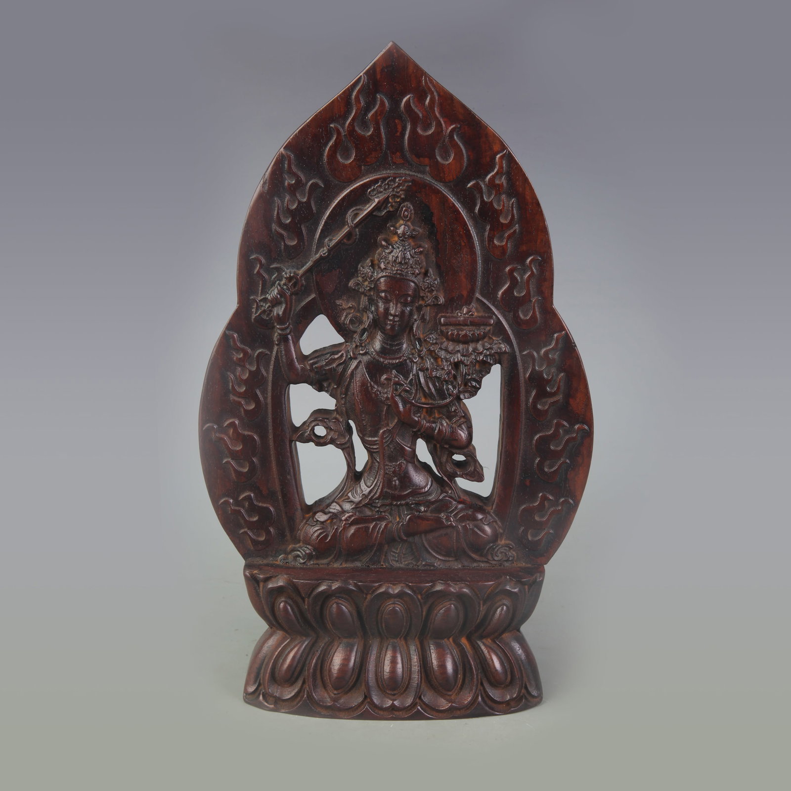 A FINE ROSEWOOD CARVED MANJUSHRI BODHISATTVA STATUE: Qing Dynasty; Width: 6.0 inch; High: 9.8 inch; . Wooden base for display only