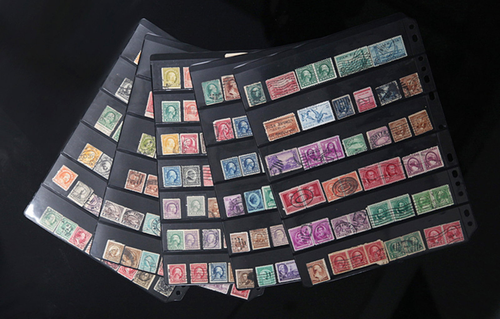 GROUP OF OLD AMERICAN OLD STAMPS: Long: 0.9 inch; Width: 0.75 inch. Wooden base for display only
