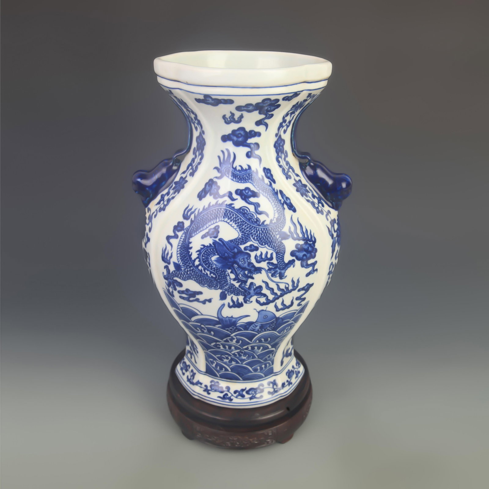BLUE AND WHITE DRAGON PATTERN BEAST EAR APPRECIATION PORCELAIN VASE: Qing Dynasty; High: 13.50 inch; Diameter: 7.80 inch; . Wooden base for display only