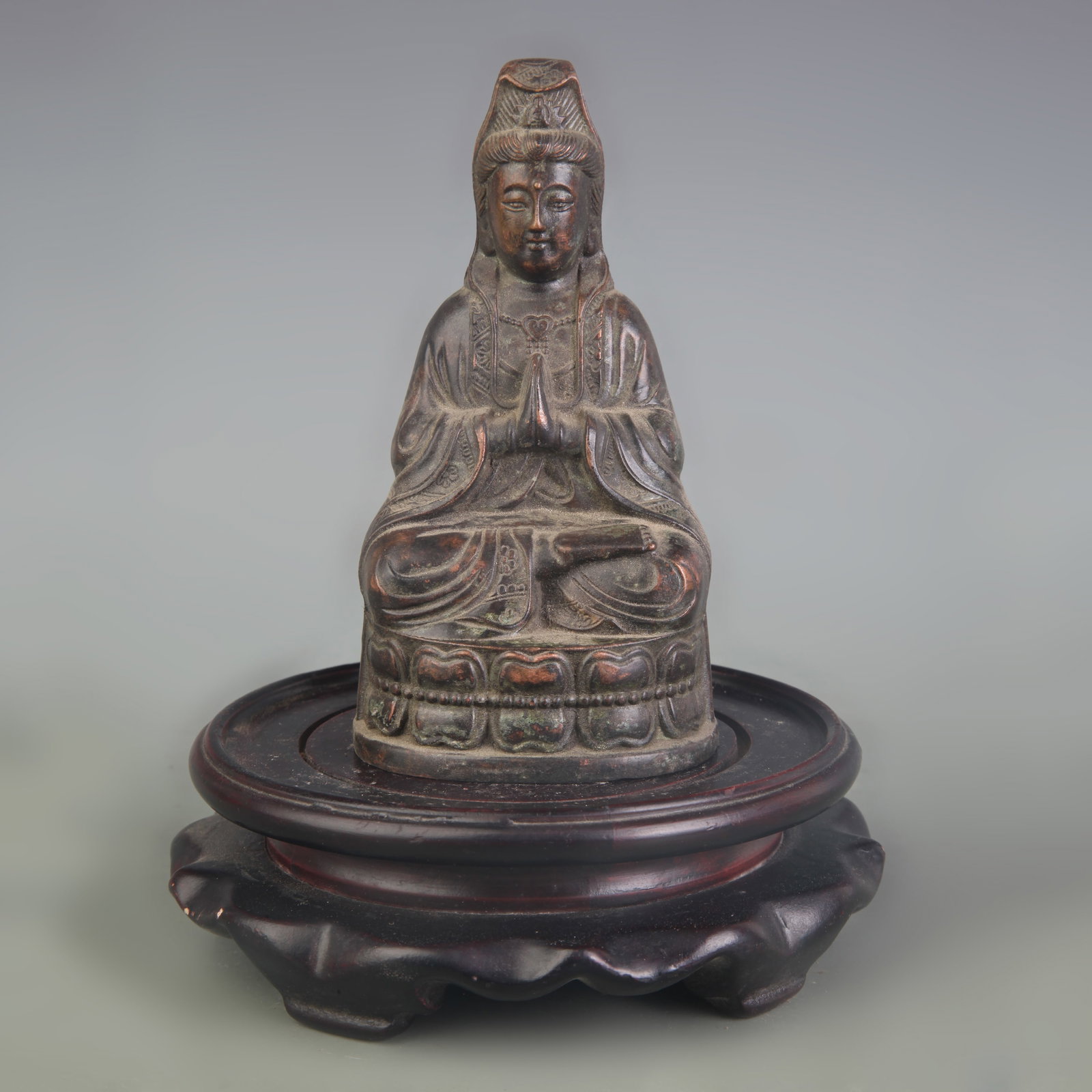 A SMALL SEATED FIGURE OF GUANYIN: Qing Dynasty; High: 4.8 inch; . Wooden base for display only