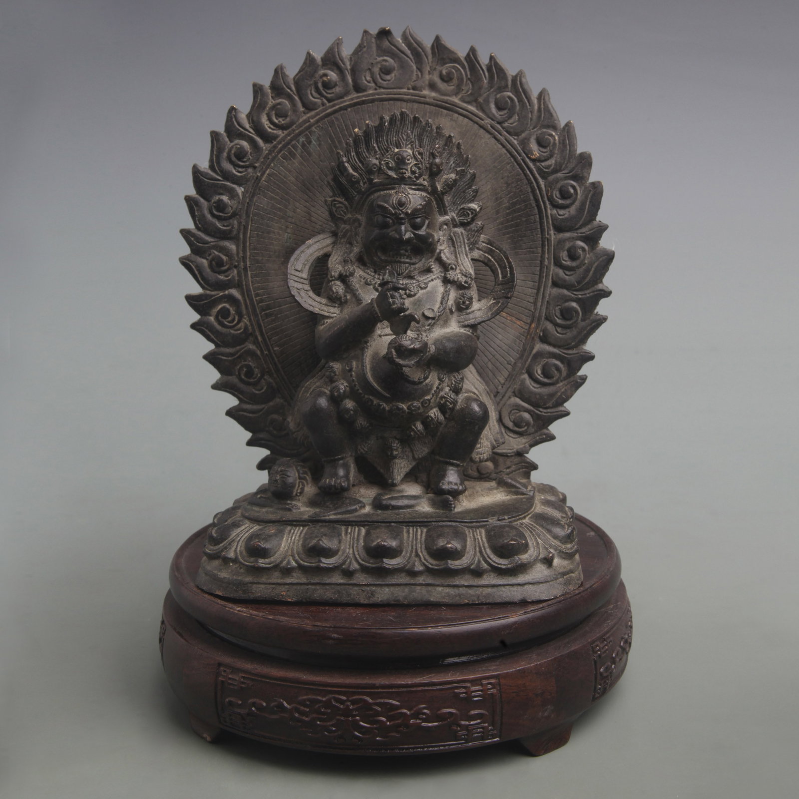 A FINE TWO-ARMED MAHAKALA BRONZE STATUE: Qing Dynasty; High: 7.3 inch; Width: 6.1 inch; . Wooden base for display only